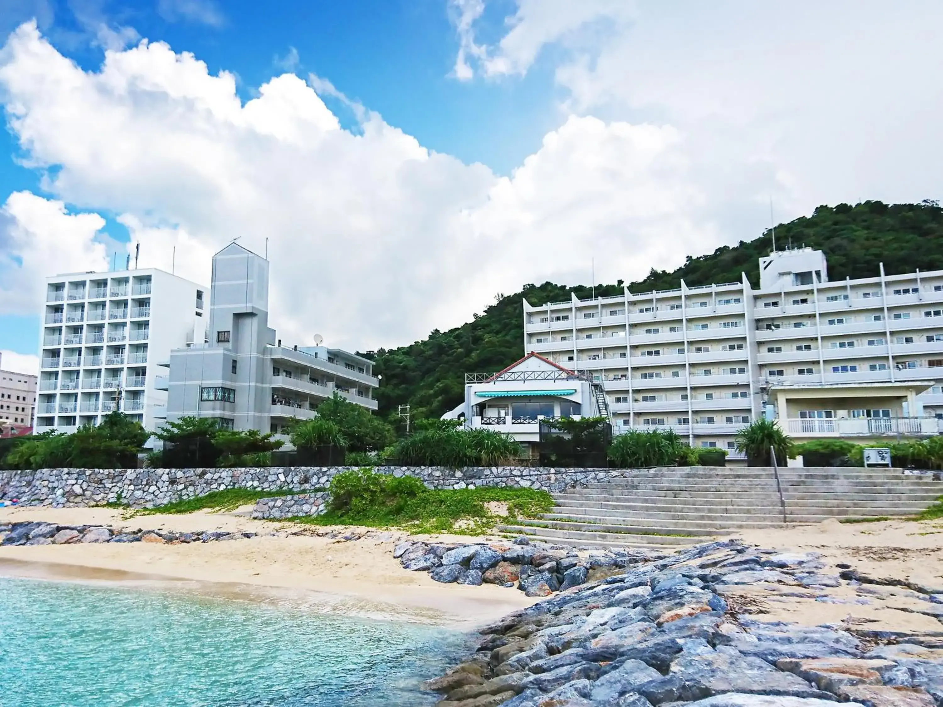 Property building in Kariyushi Condominium Resort Sea Side House Property building in Kariyushi Condominium Resort Sea Side House