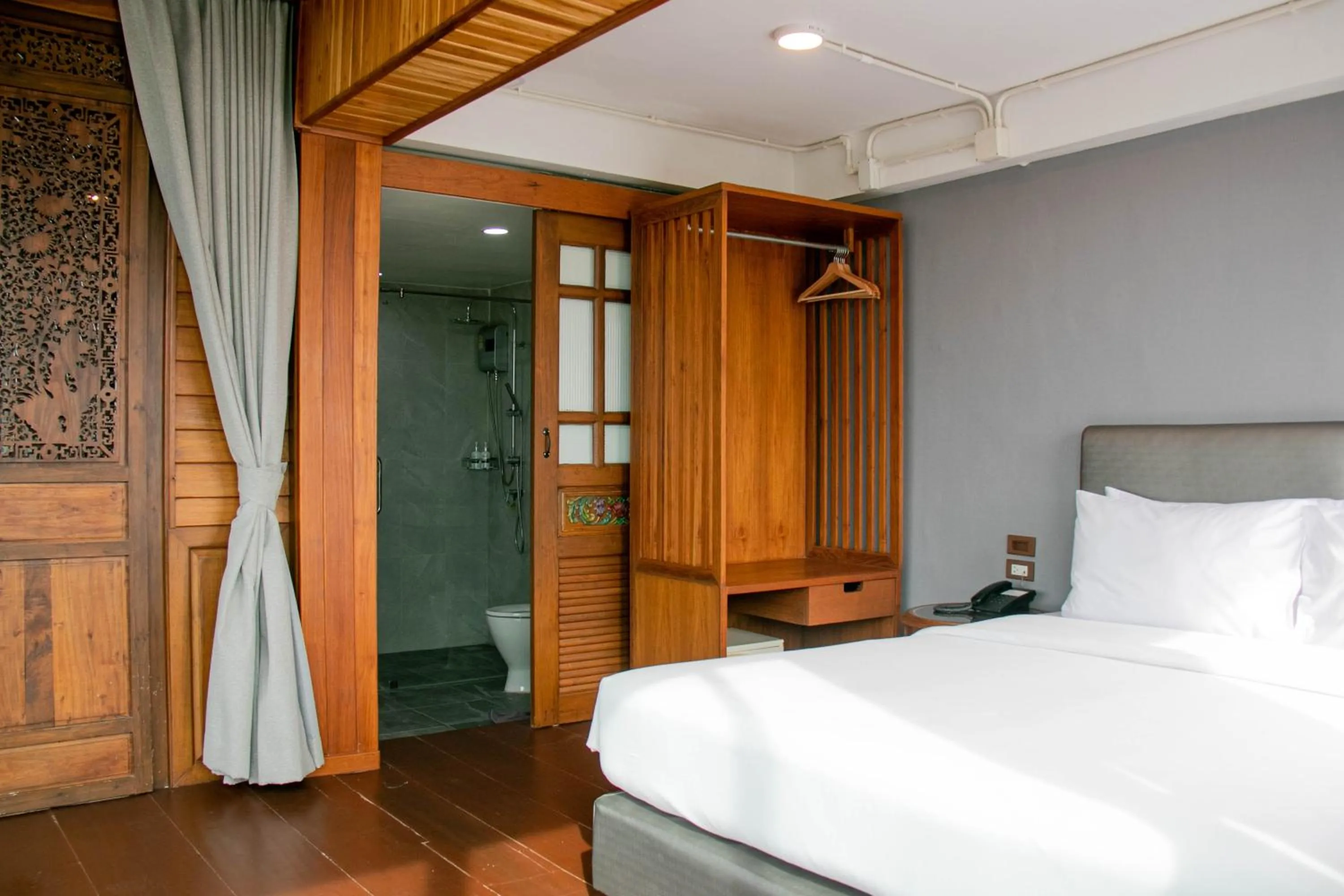 Bed in Lamphu Tree House Boutique Hotel