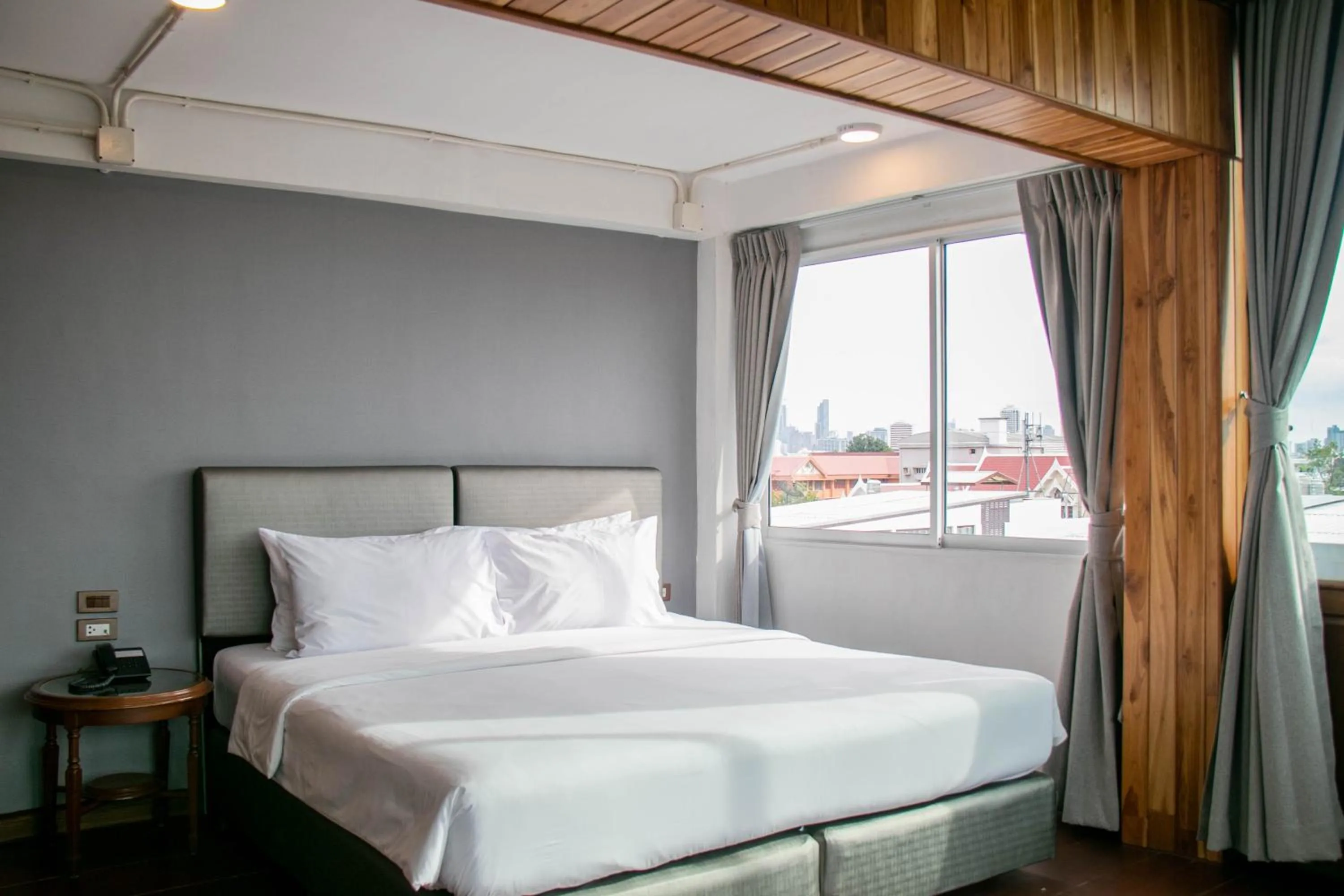 Bed in Lamphu Tree House Boutique Hotel