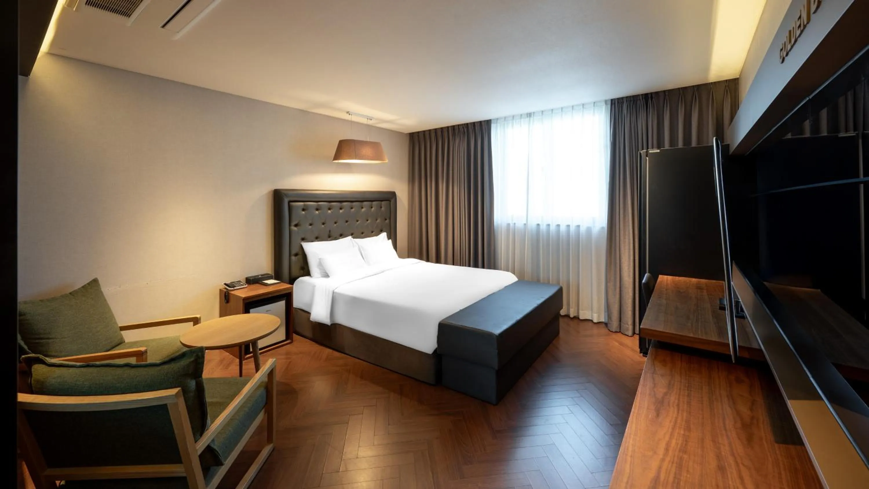 Bed in Golden Business Hotel