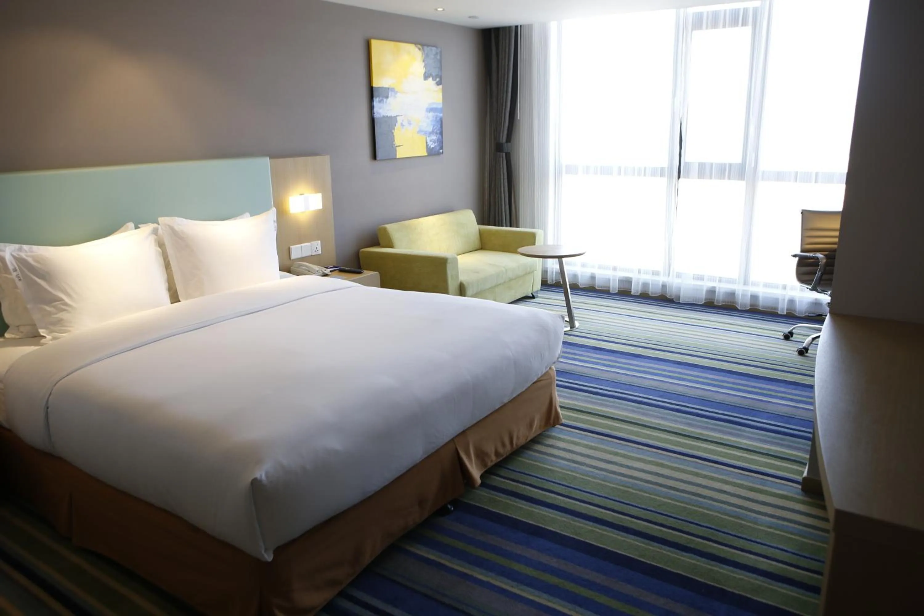 Bed in Holiday Inn Express Yingkou Onelong Plaza by IHG