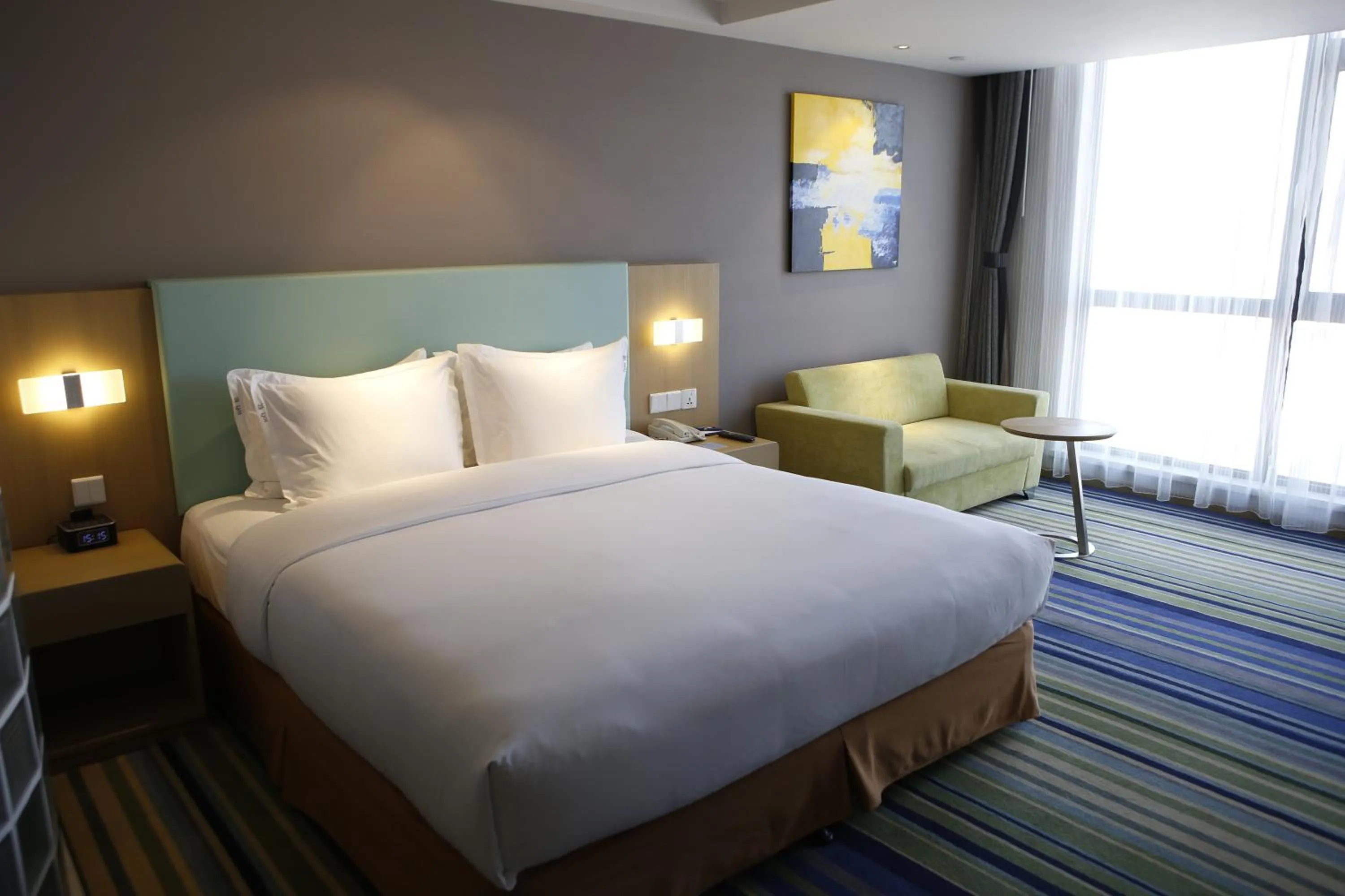 Bed in Holiday Inn Express Yingkou Onelong Plaza by IHG