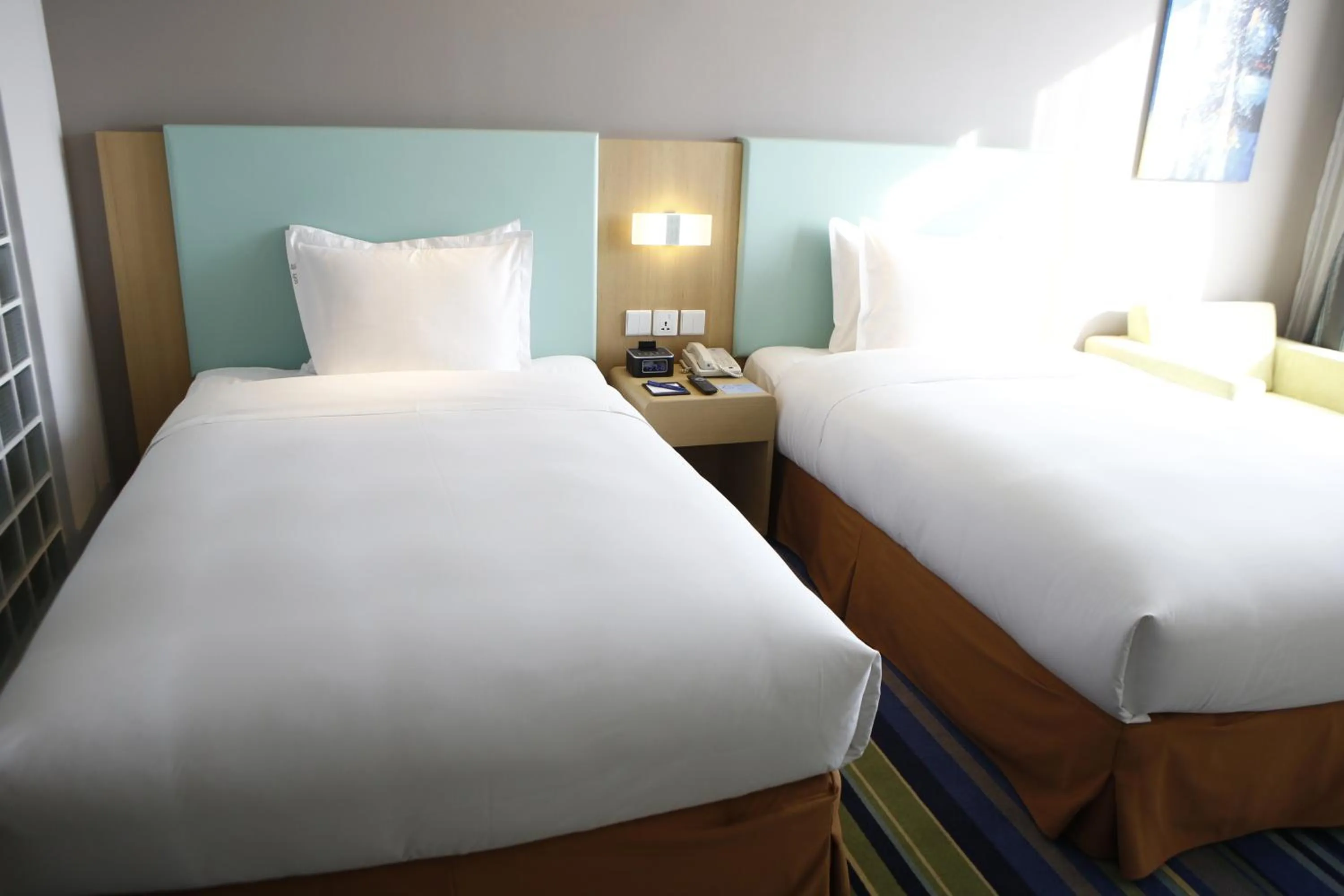 Bed in Holiday Inn Express Yingkou Onelong Plaza by IHG