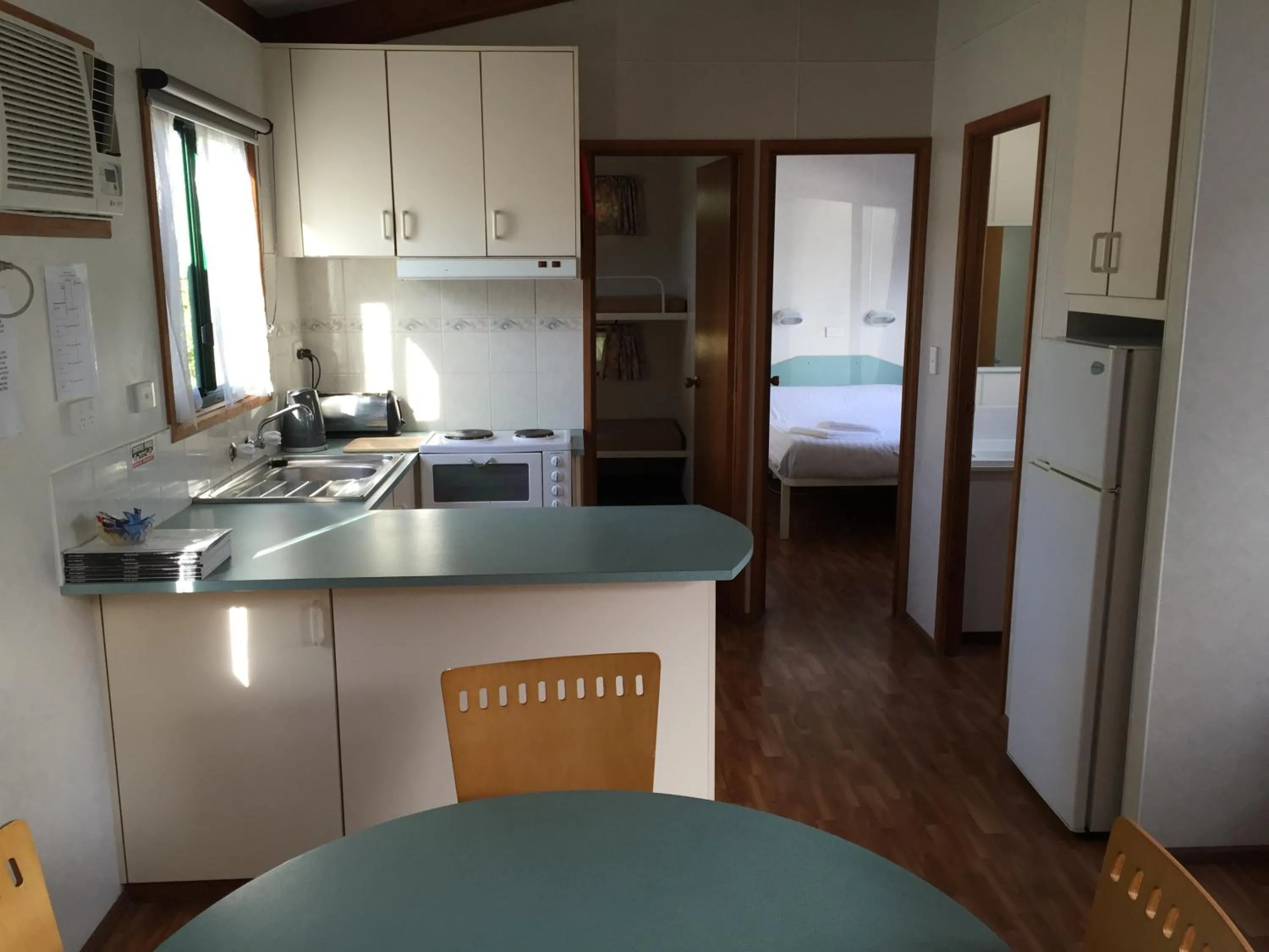 Bed in Inverloch Cabins & Apartments