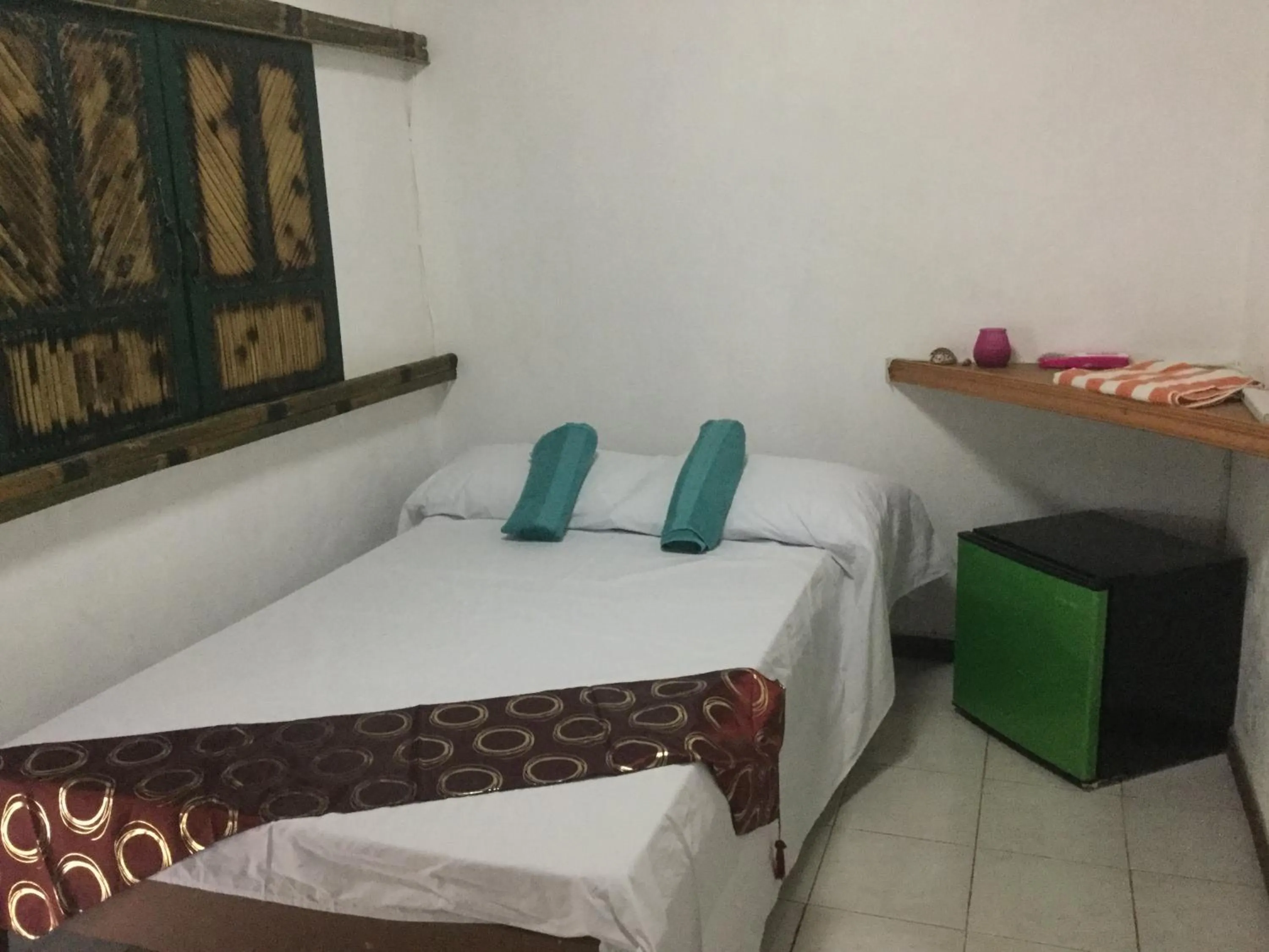 Bed in Turtle Cove Exclusive Island Resort