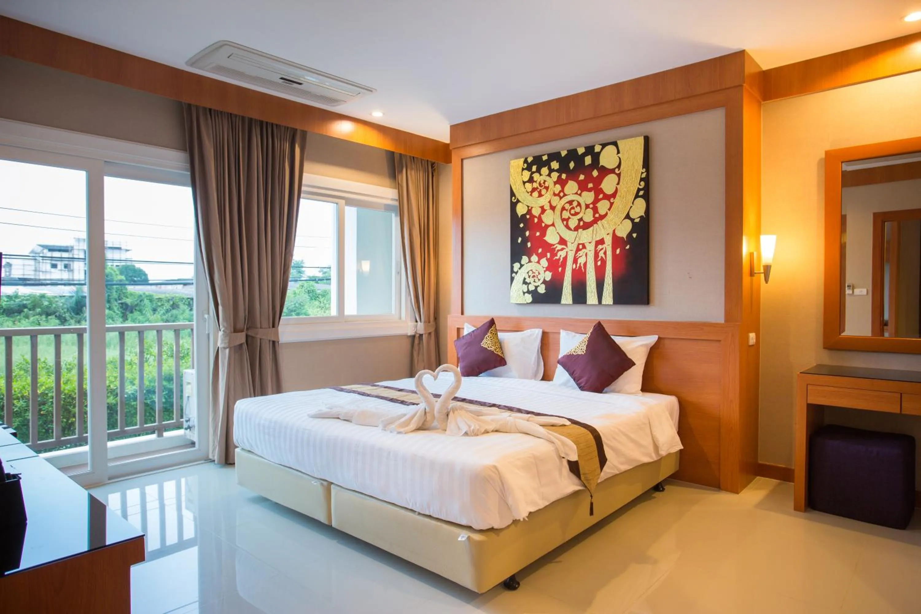 Bed in Romantic Khon Kaen Hotel
