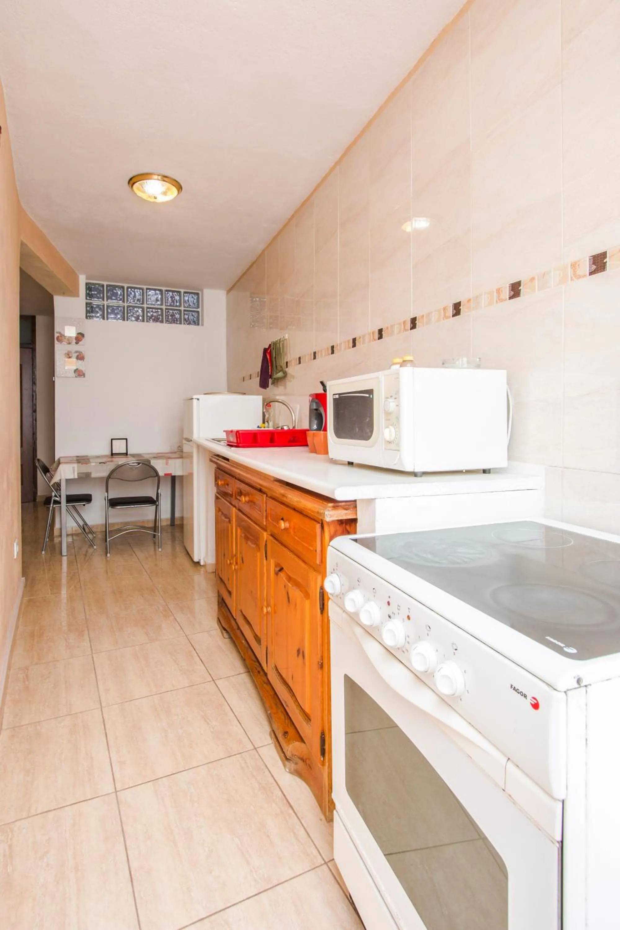 Kitchen or kitchenette in A Ensuite Apartment con Zona de Patio