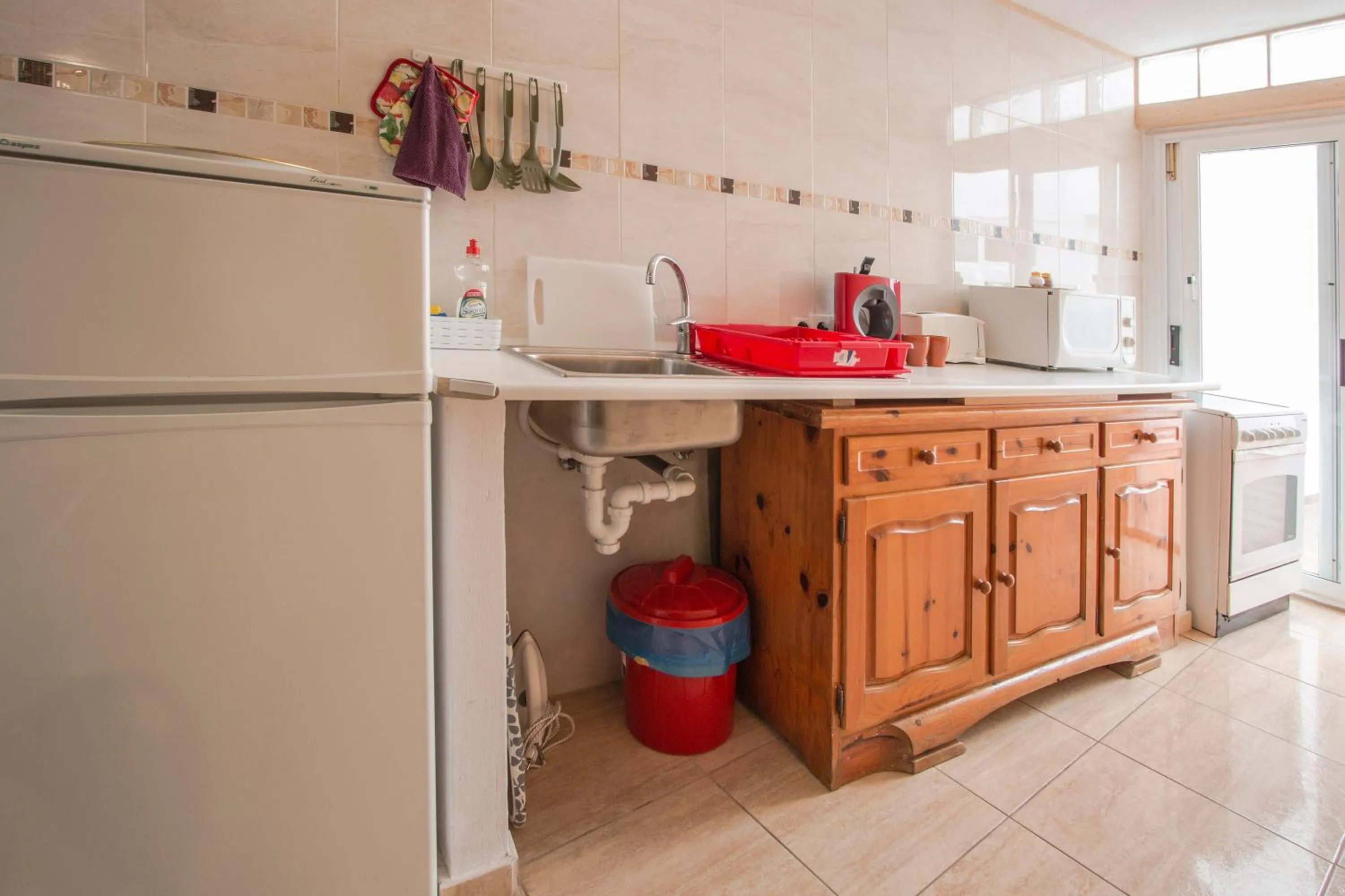 Kitchen or kitchenette in A Ensuite Apartment con Zona de Patio