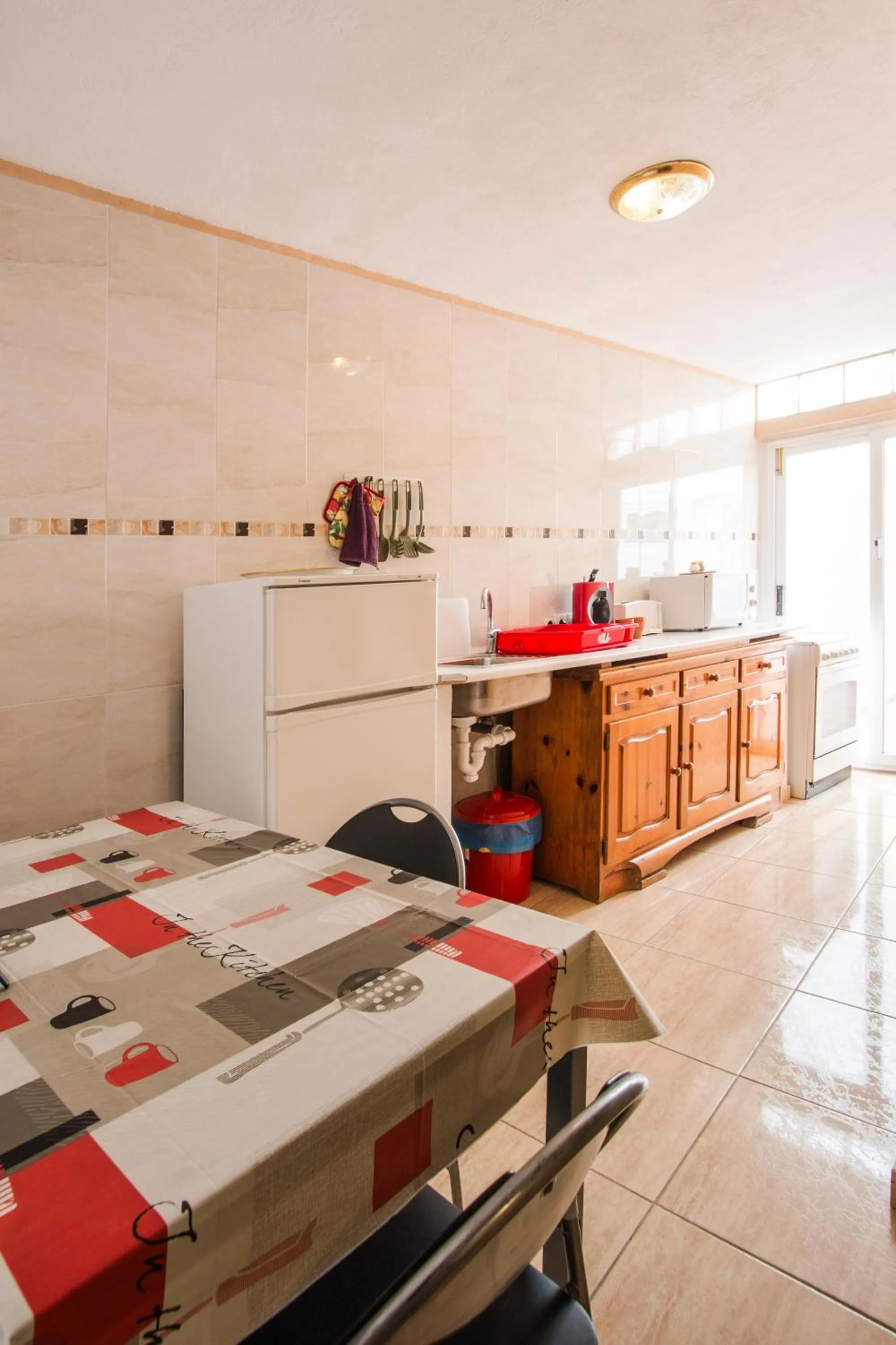 Kitchen or kitchenette in A Ensuite Apartment con Zona de Patio