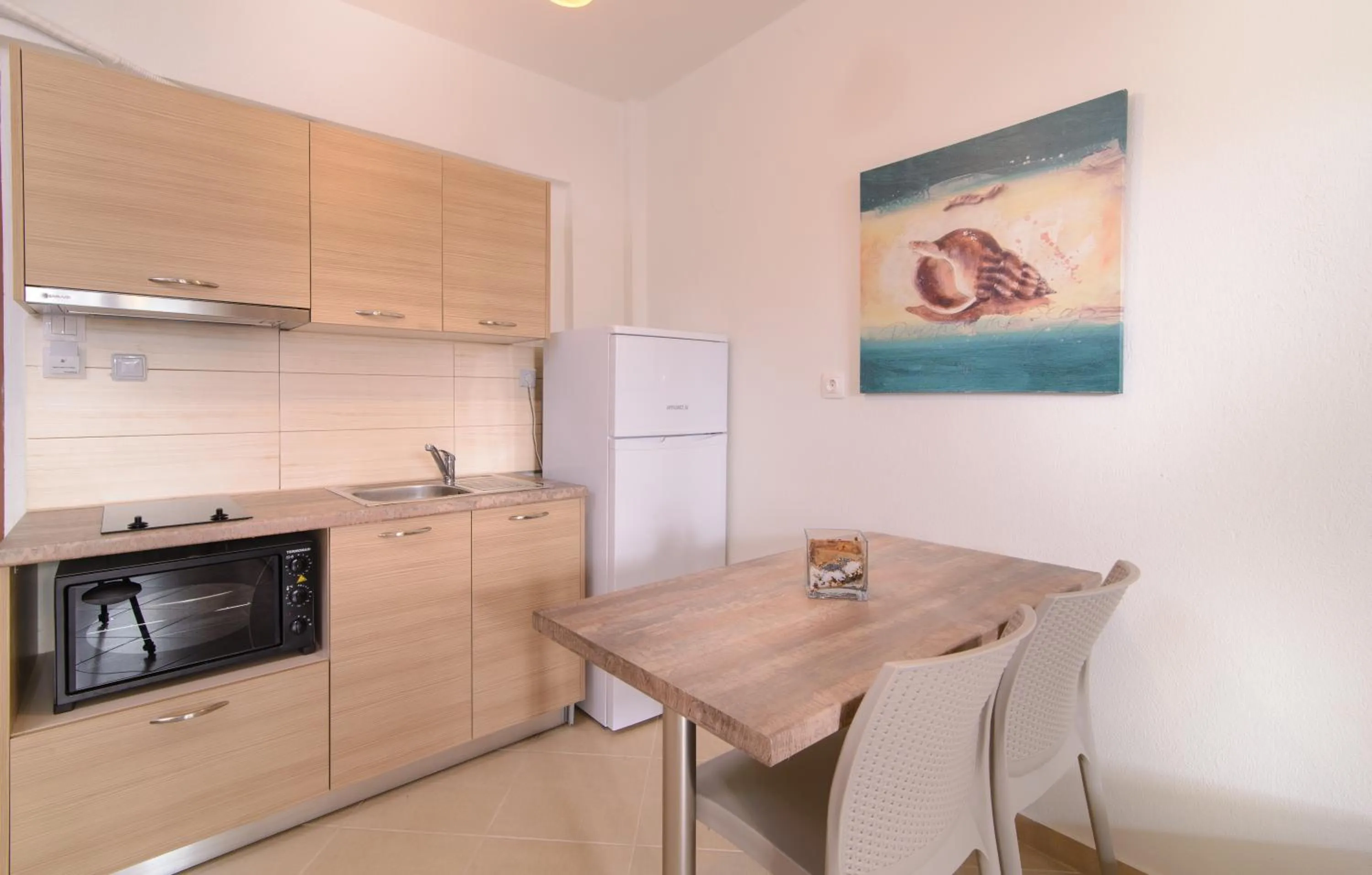 Kitchen or kitchenette in Apanemia by Flegra Hotels