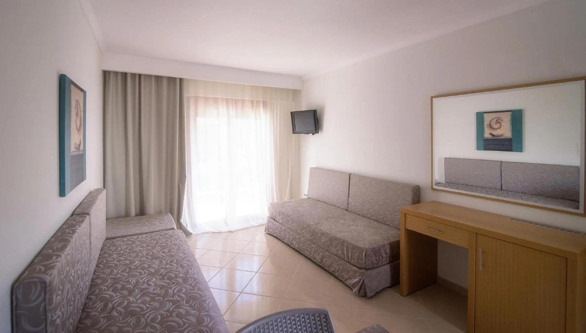 Seating area in Apanemia by Flegra Hotels