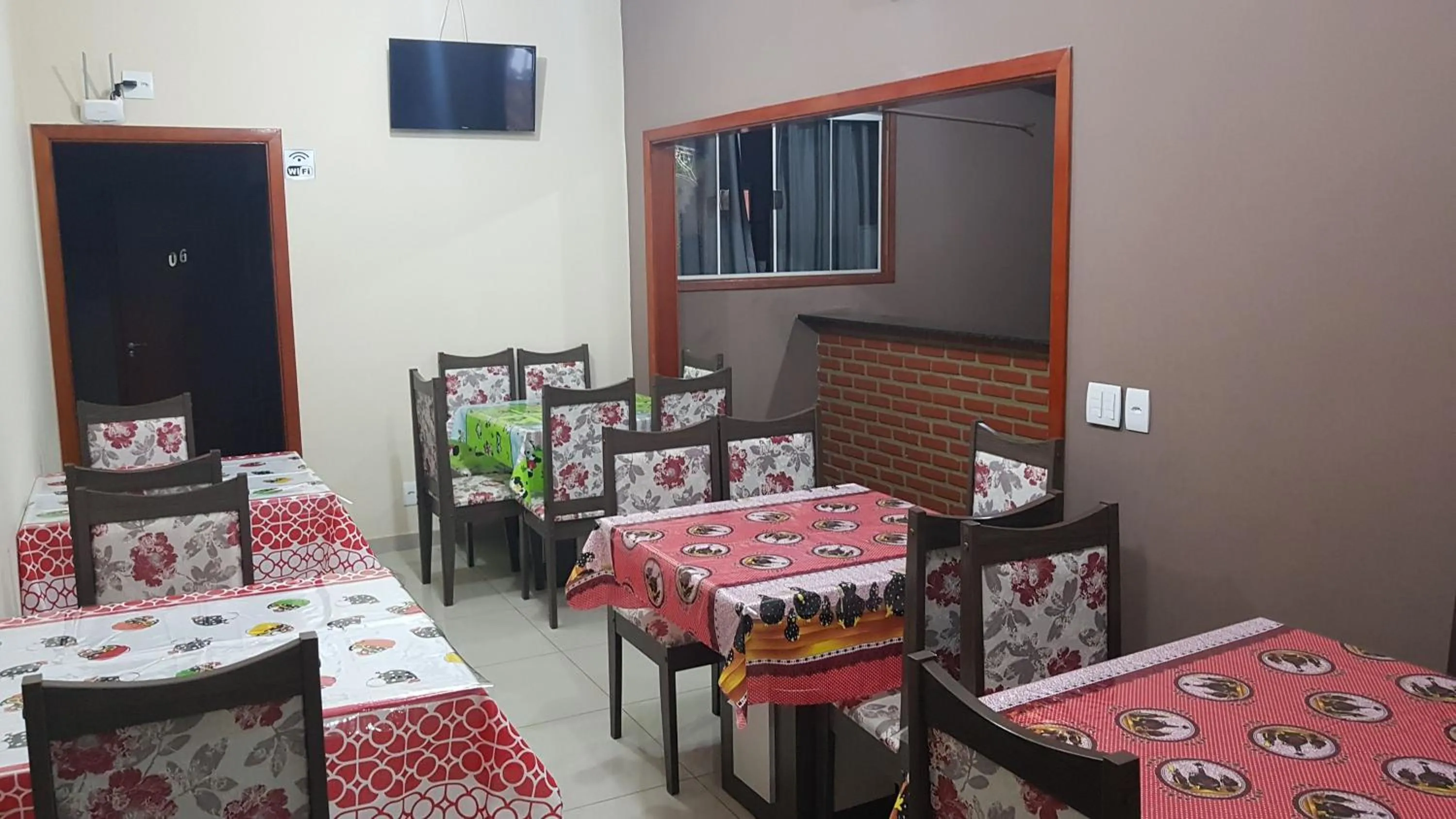 Communal lounge/ TV room in Pousada Pimenta Olimpia