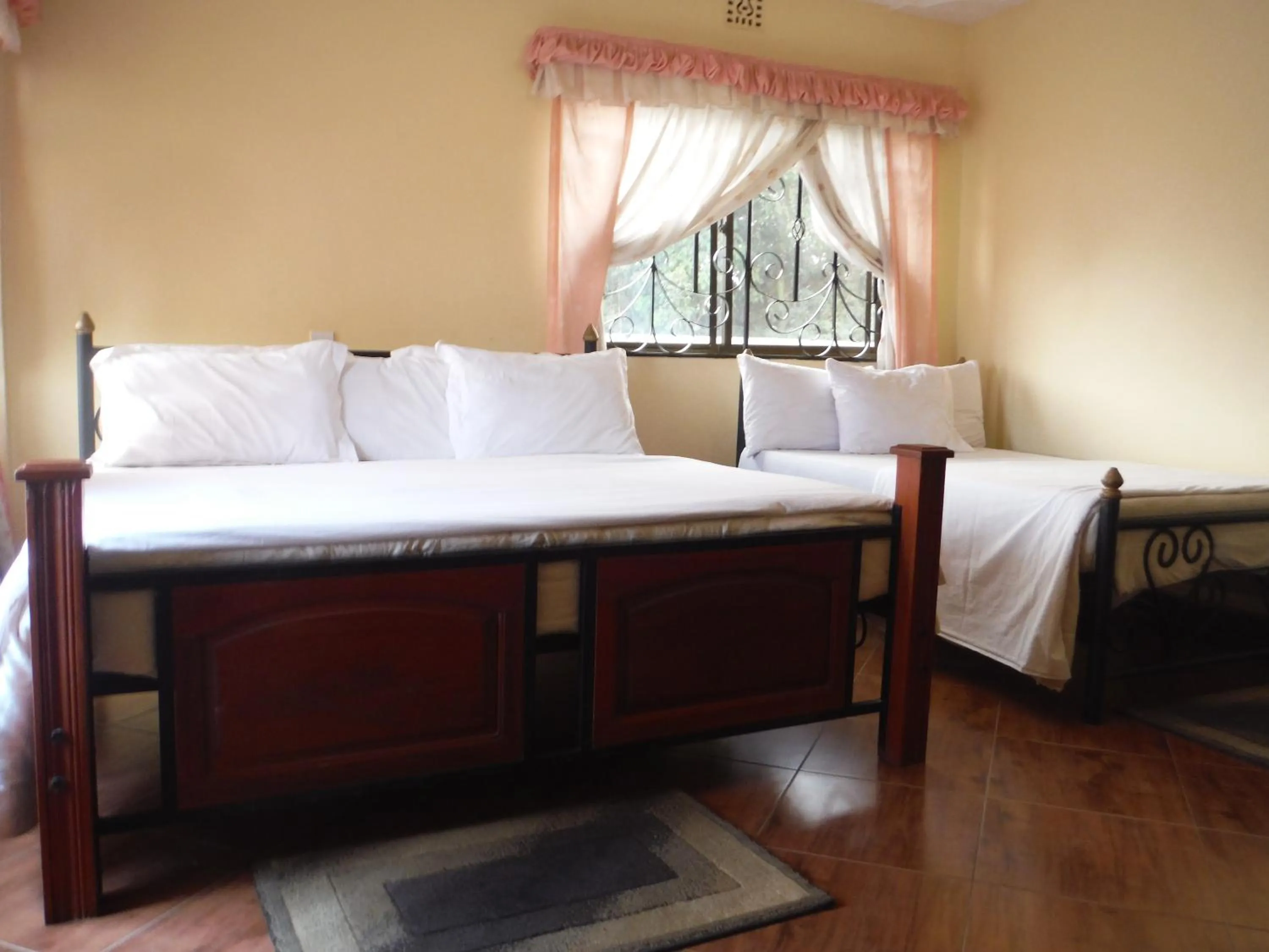 Bed in Bright Star Hotel & Safaris