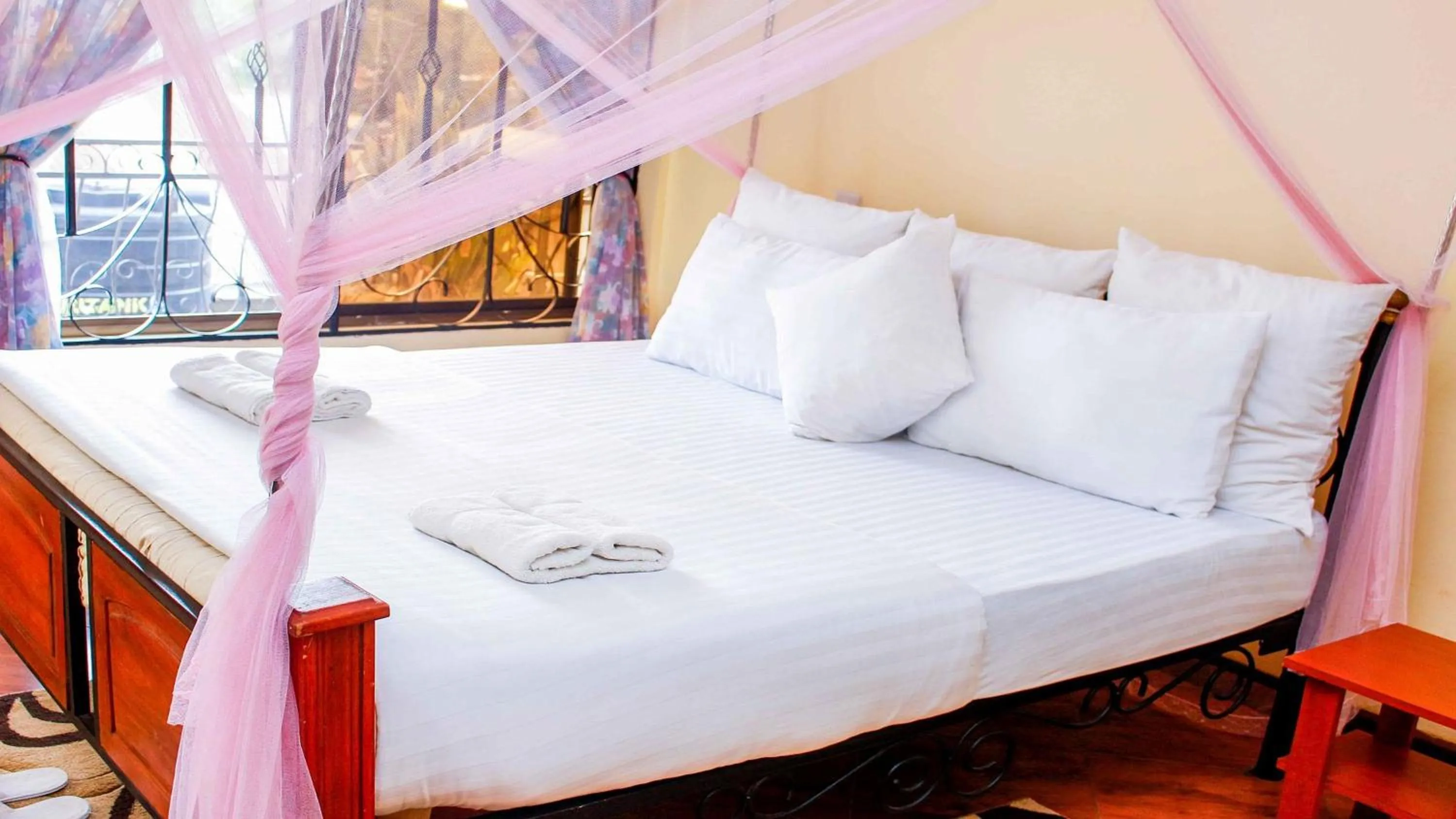 Bed in Bright Star Hotel & Safaris
