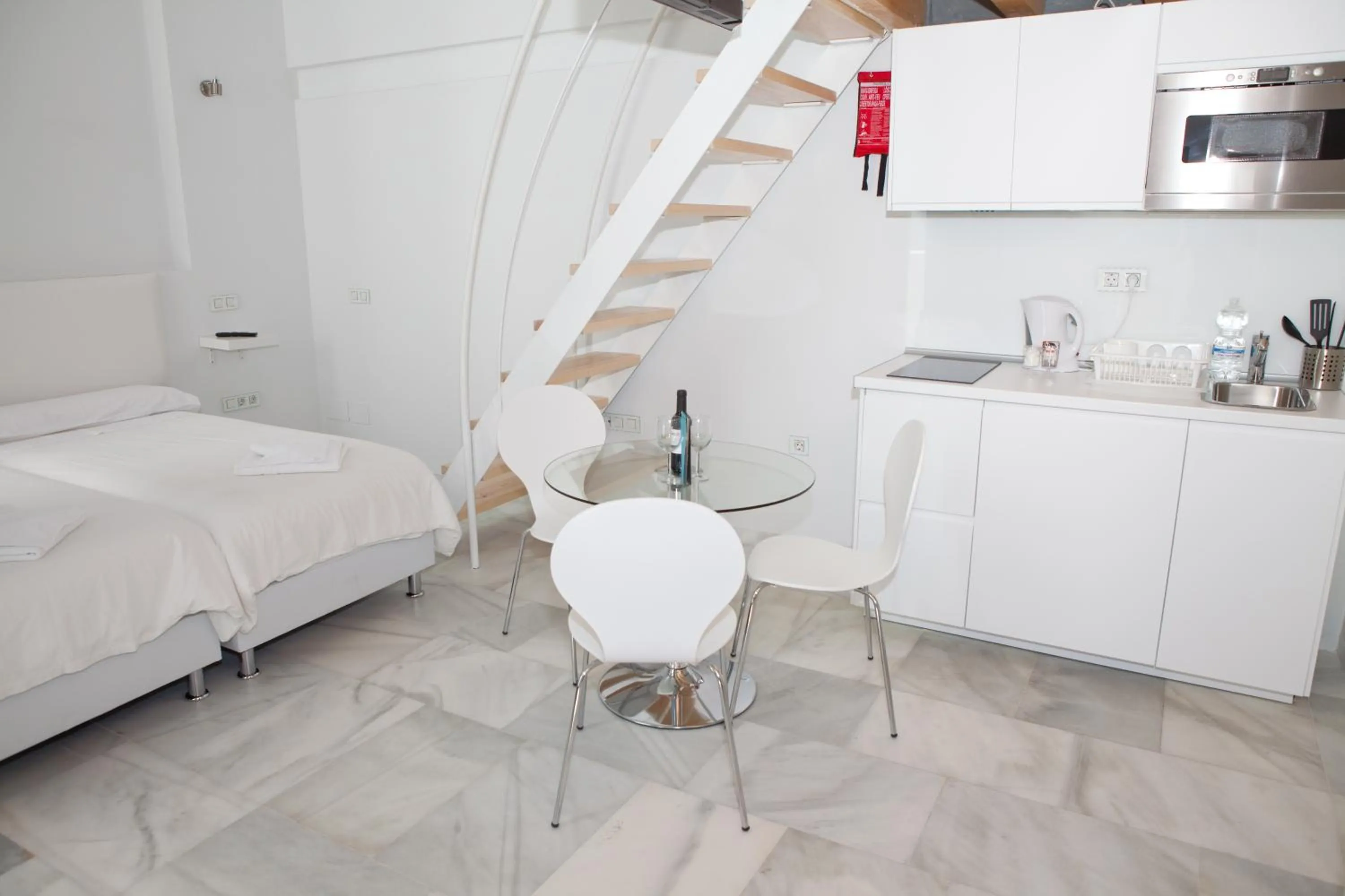 Dining area, Bed in Malaga City Breaks