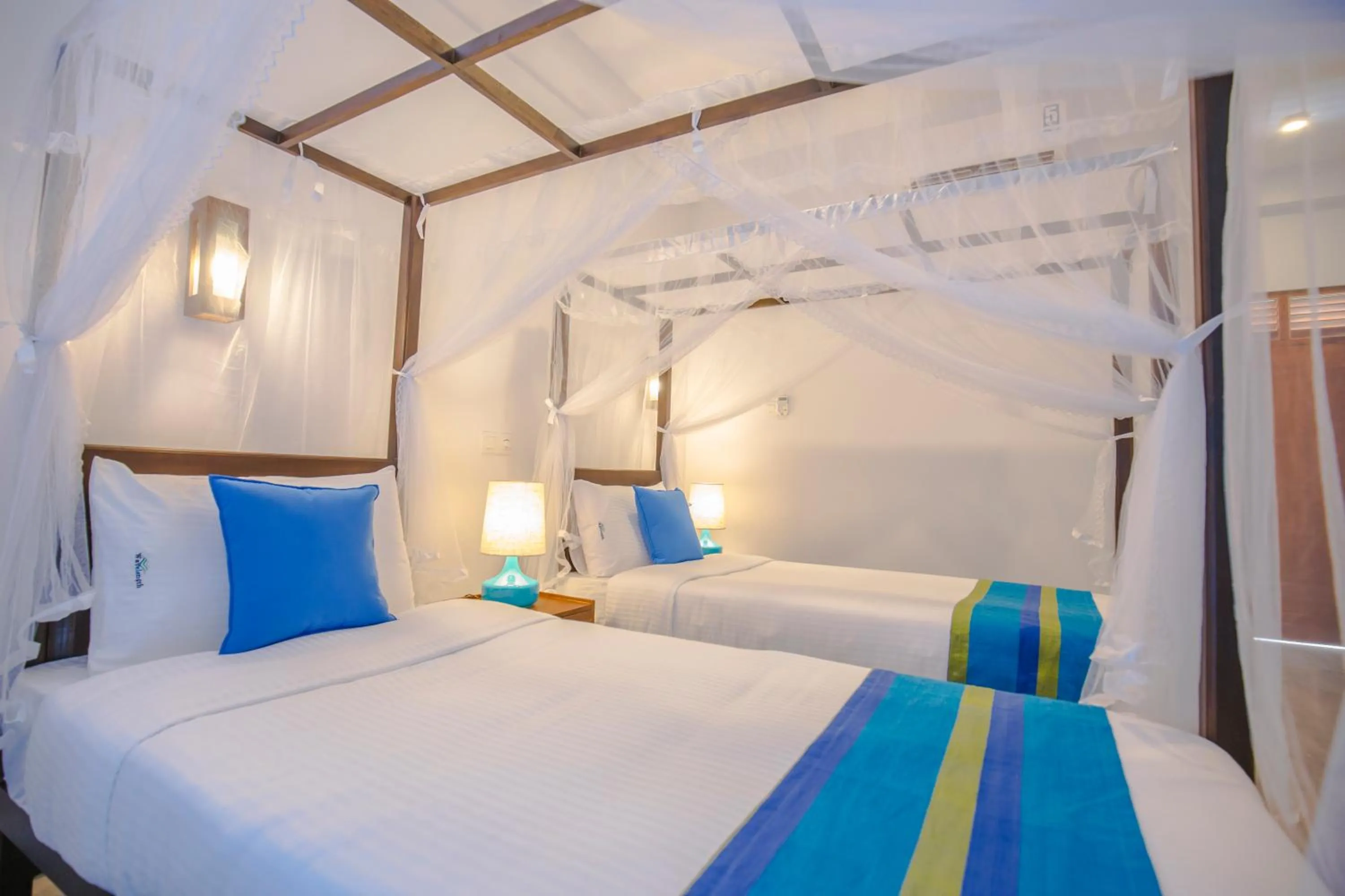 Bed in Wavelength Hotel & Wellness Center