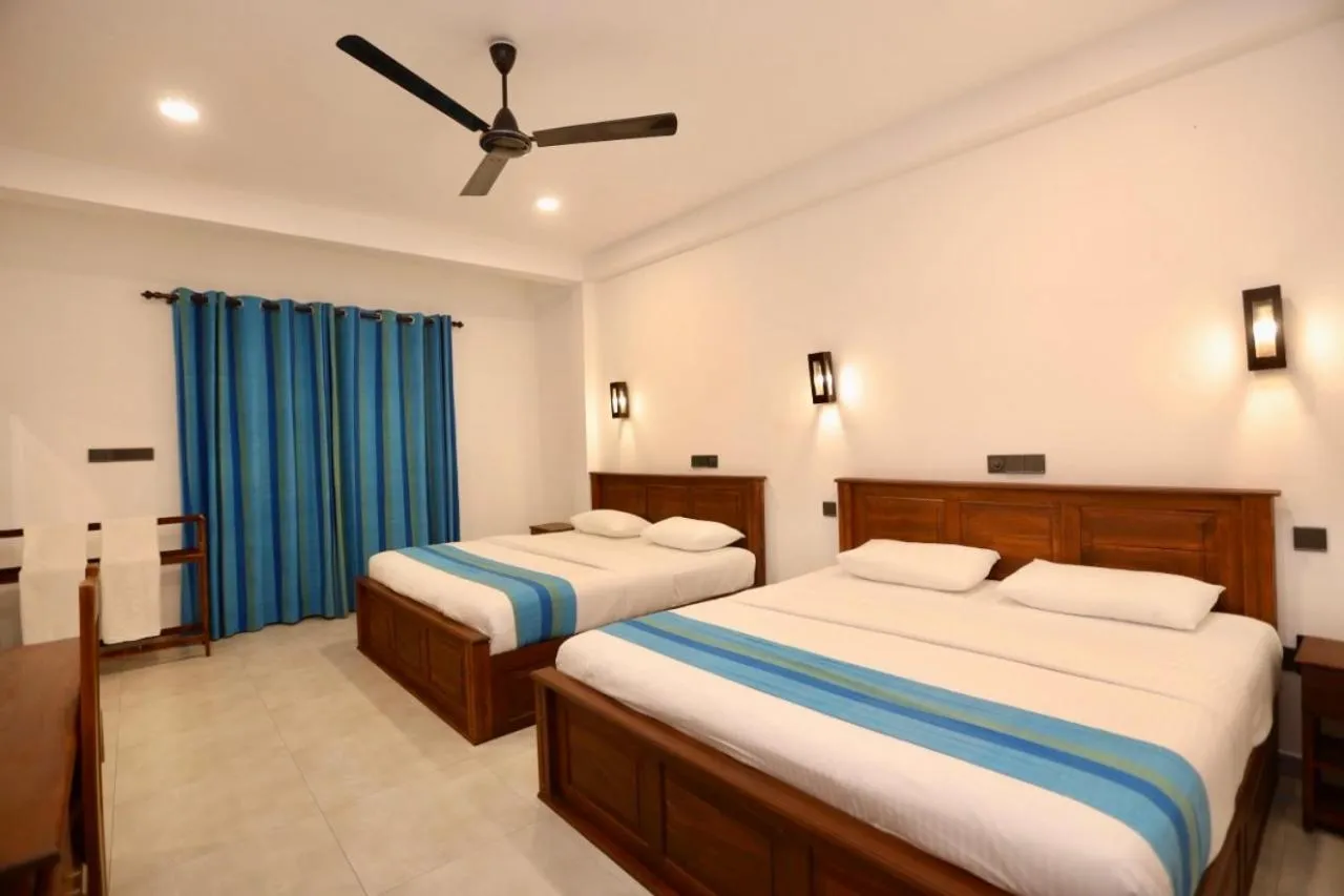 Bed in Wavelength Hotel & Wellness Center