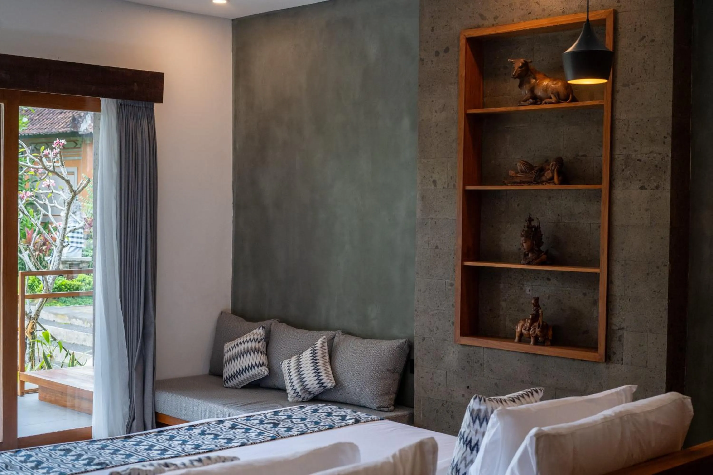 Seating area, Bed in Uma Dawa Resort and Spa