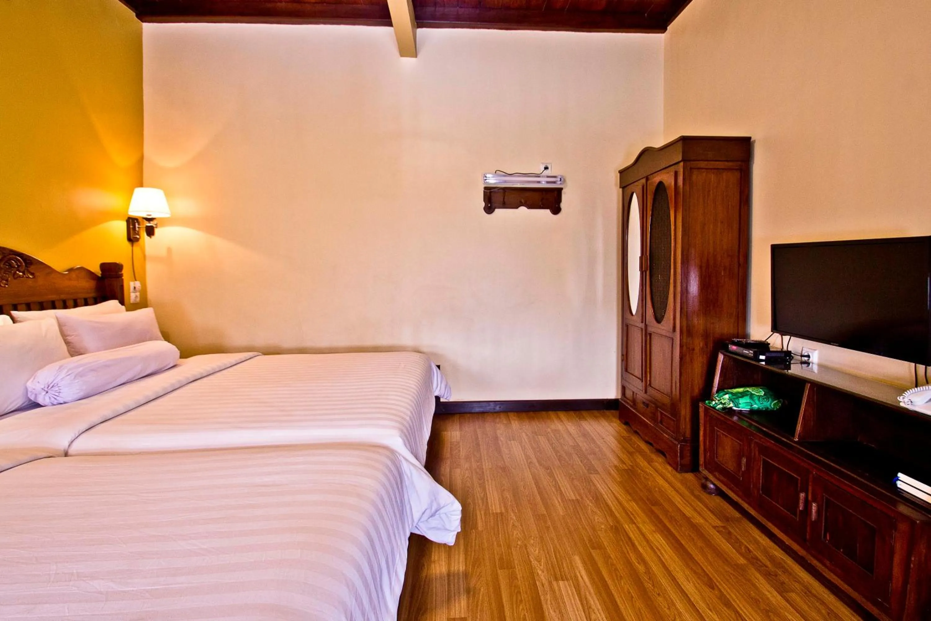 Bed in Puri Sakanti Nature Family Resort
