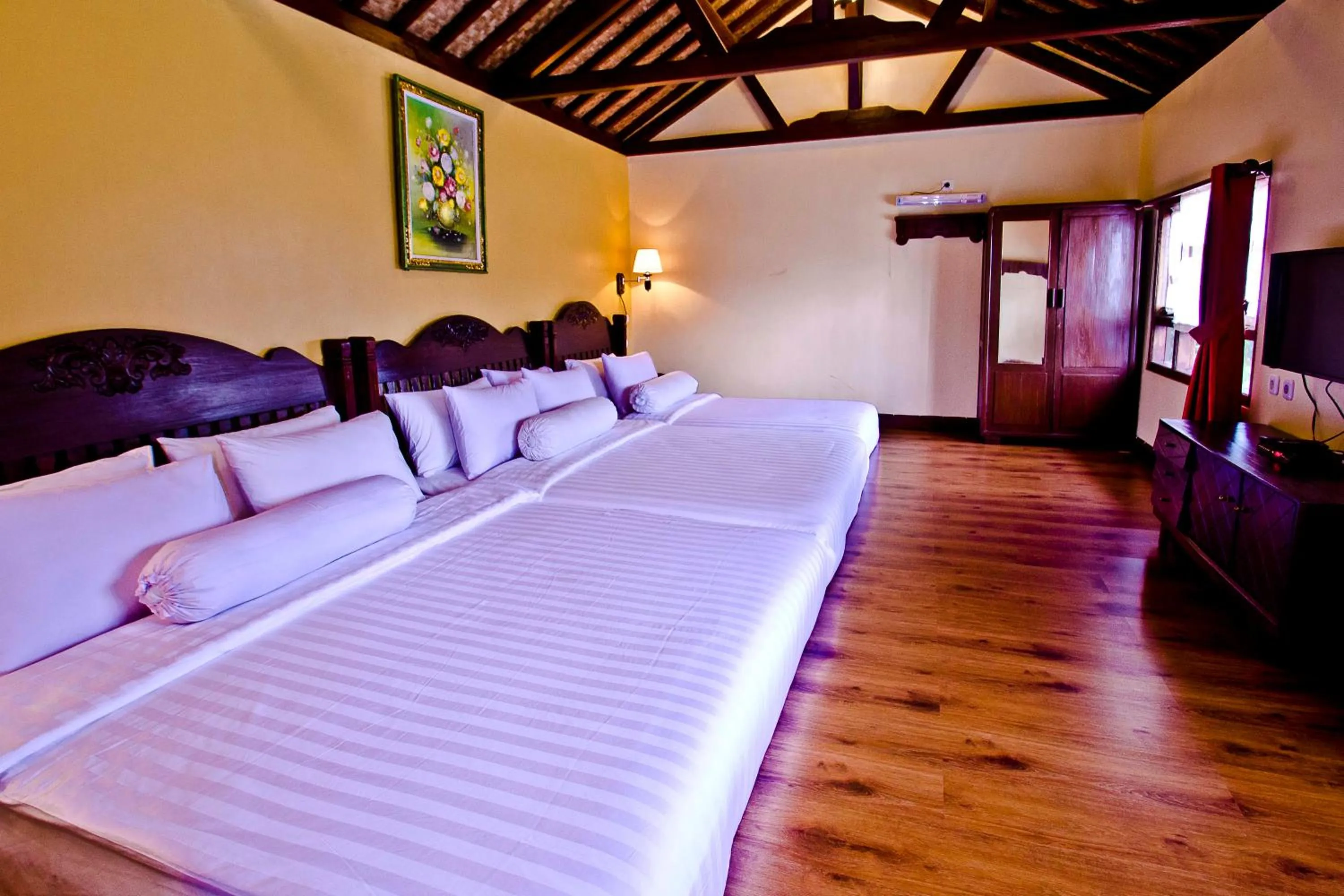 Bed in Puri Sakanti Nature Family Resort