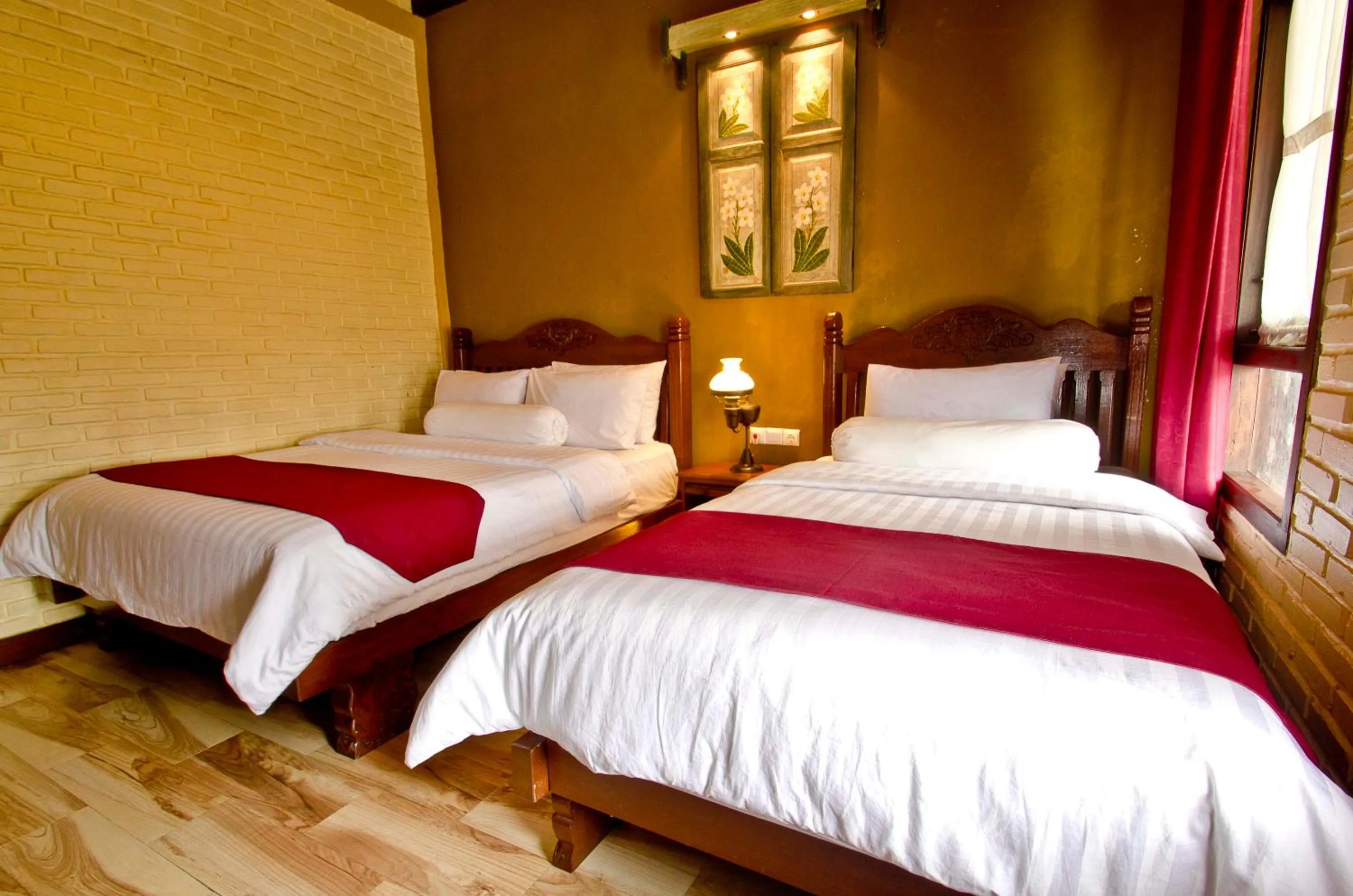 Bed in Puri Sakanti Nature Family Resort