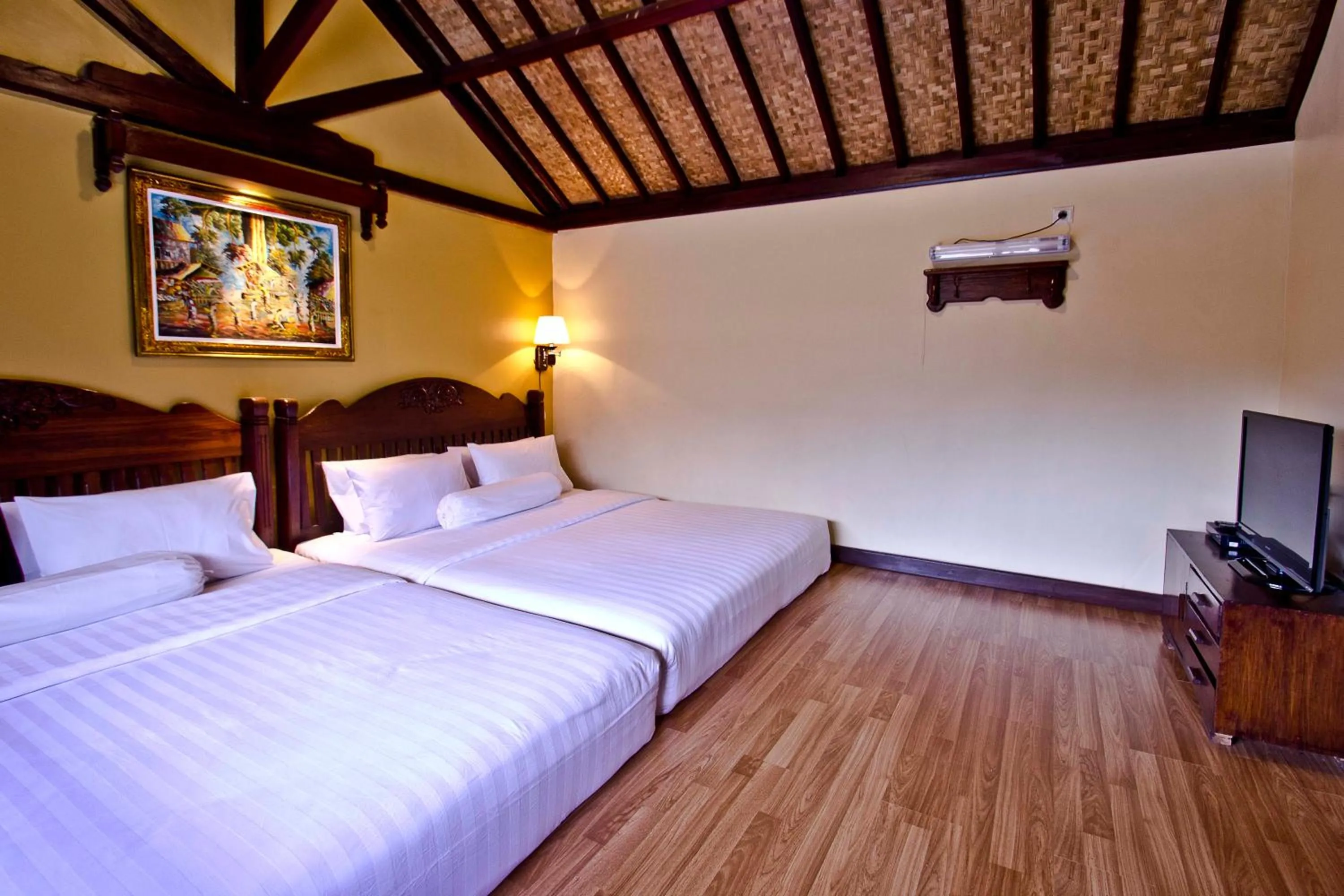 Bed in Puri Sakanti Nature Family Resort