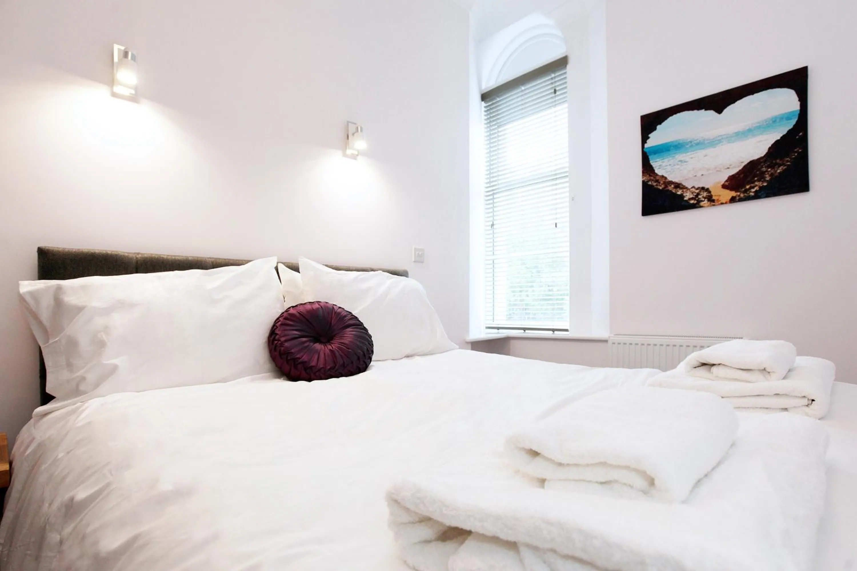 Bed in Austens Apartments