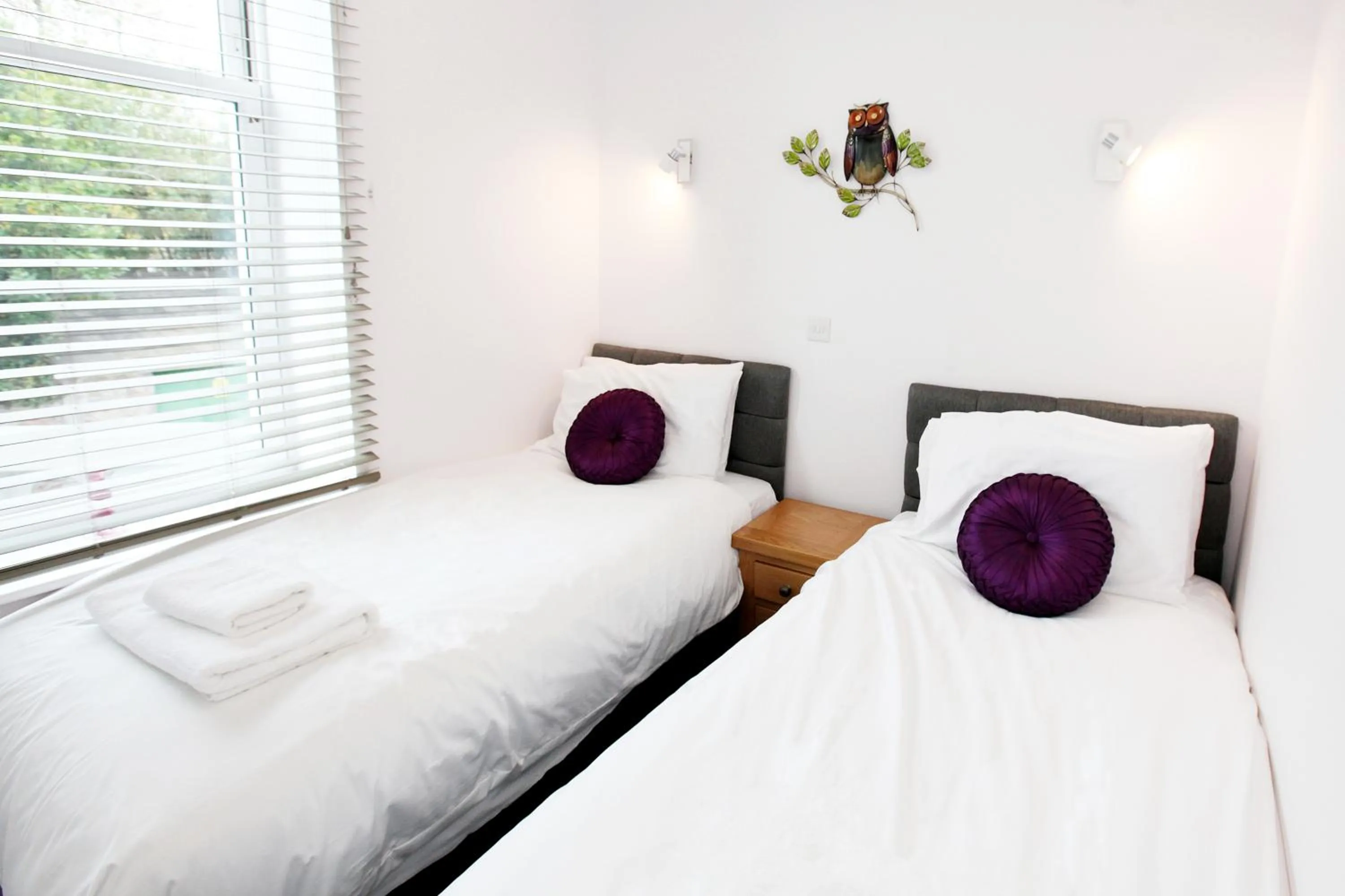 Bed in Austens Apartments