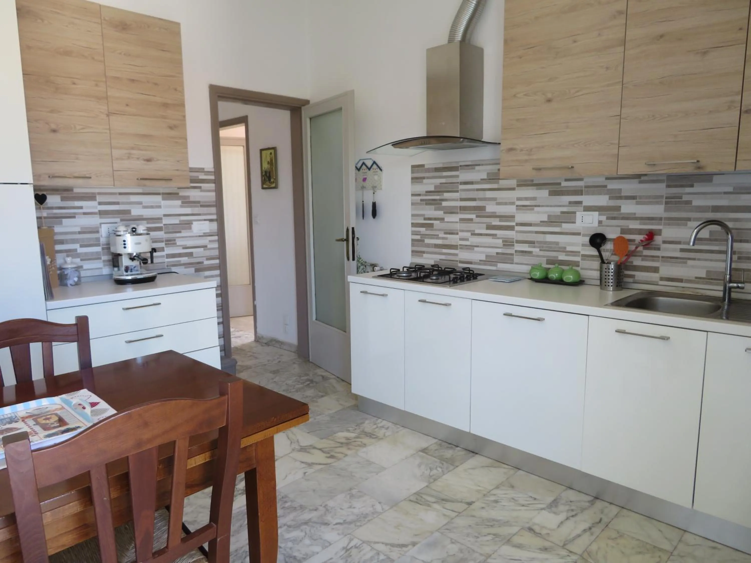 Communal kitchen in La Mimosa Chic