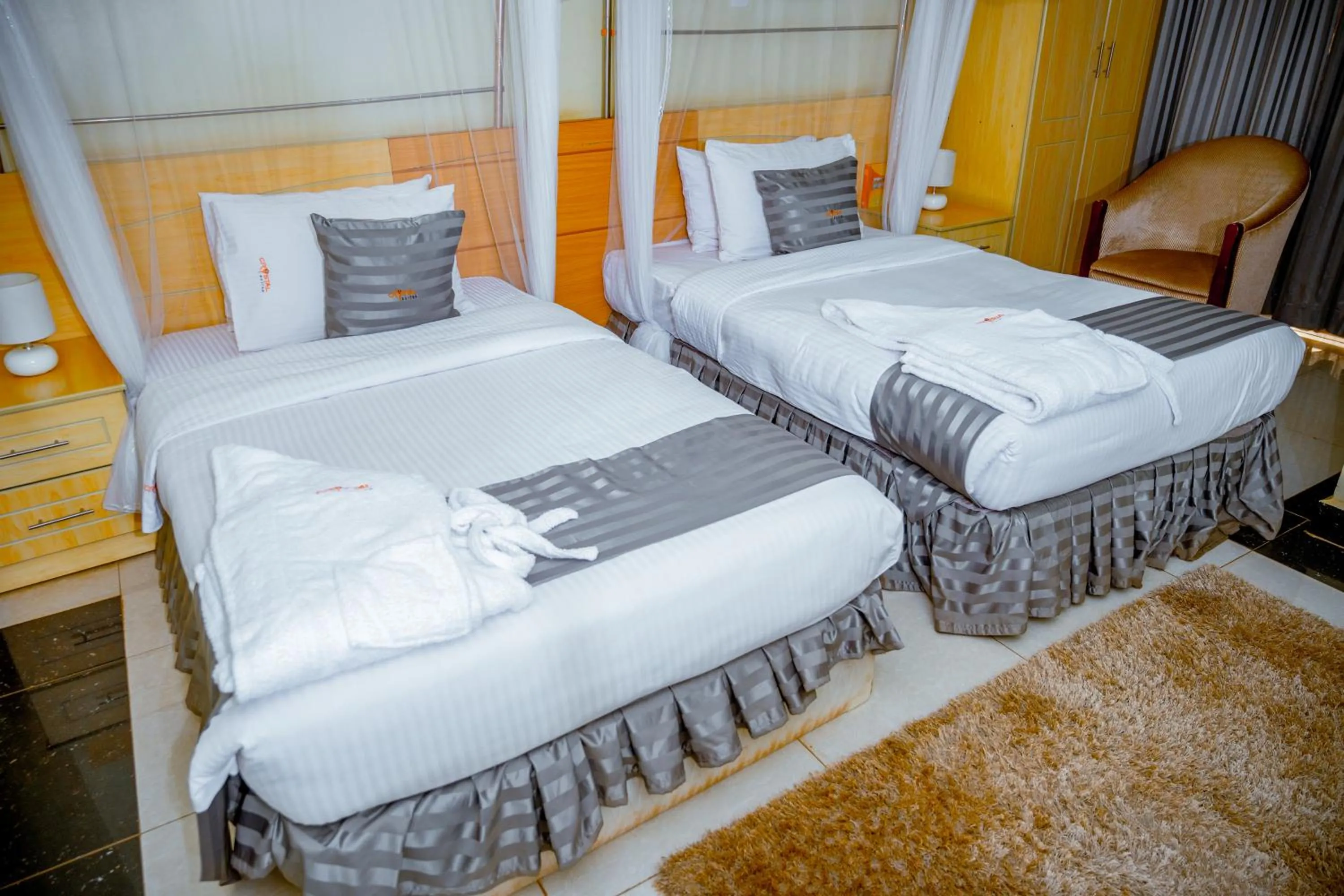 Bedroom, Bed in Crystal Suites & Apartments