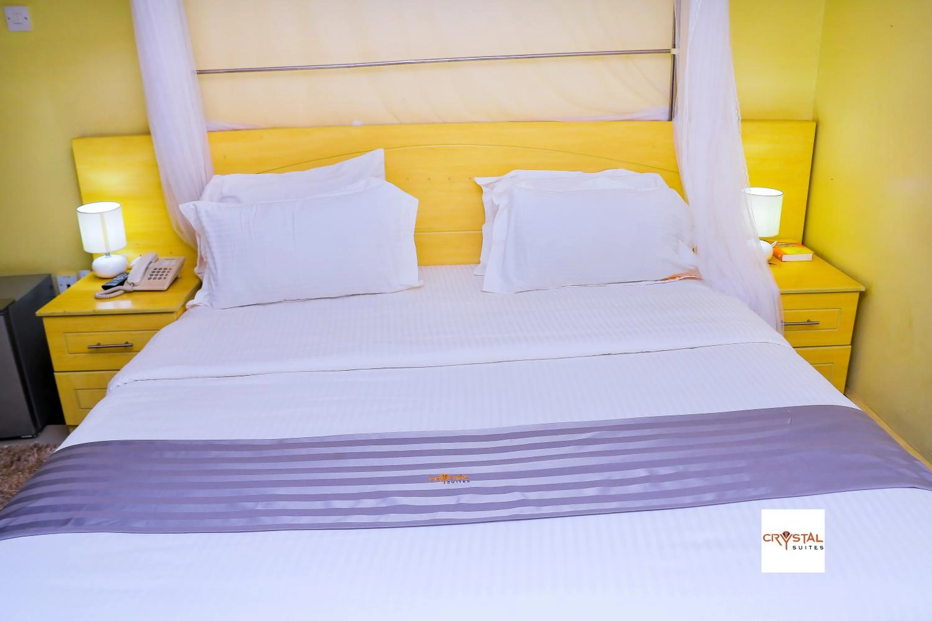 Bed in Crystal Suites & Apartments