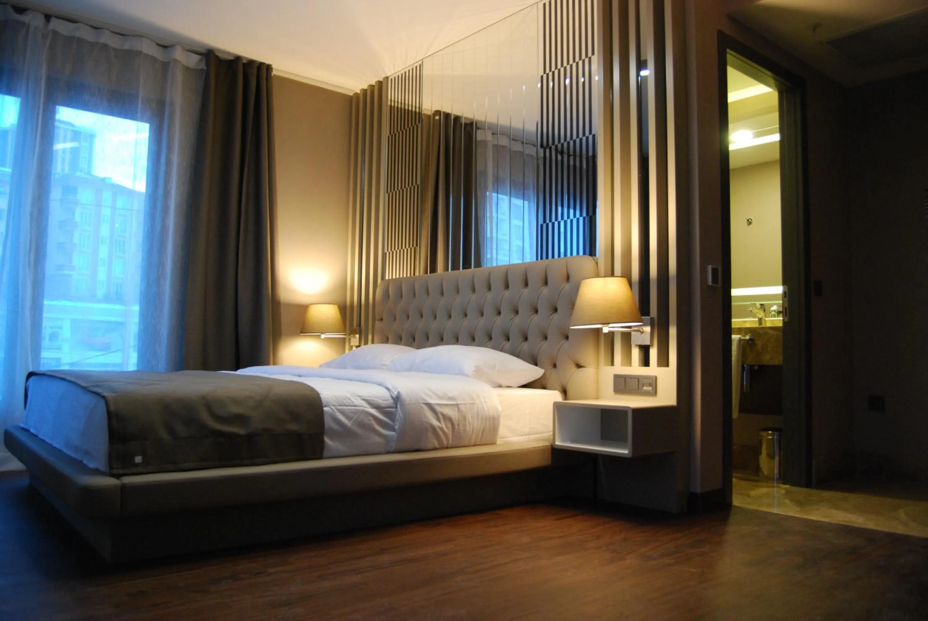 Photo of the whole room, Bed in The City Suites