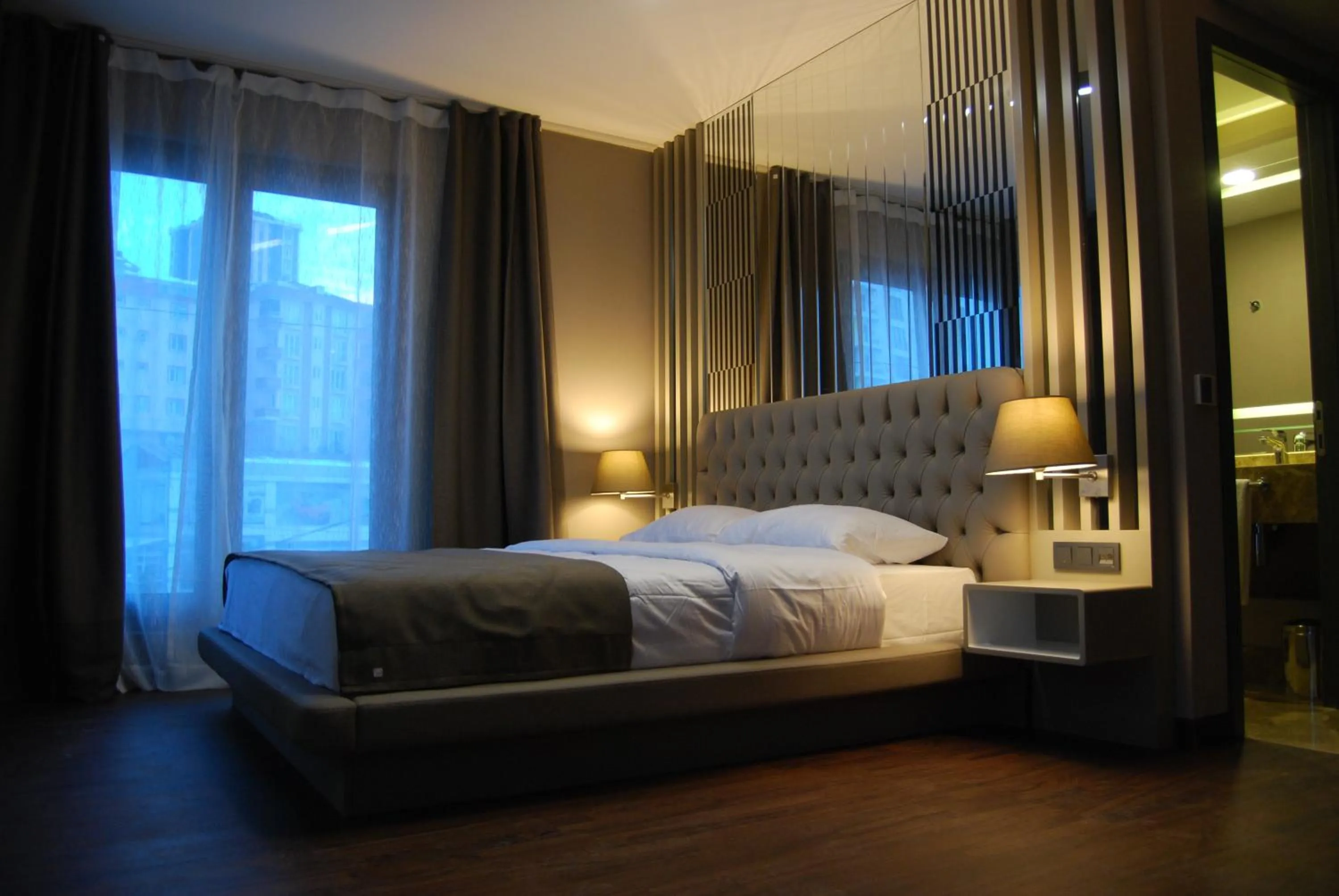 Photo of the whole room, Bed in The City Suites
