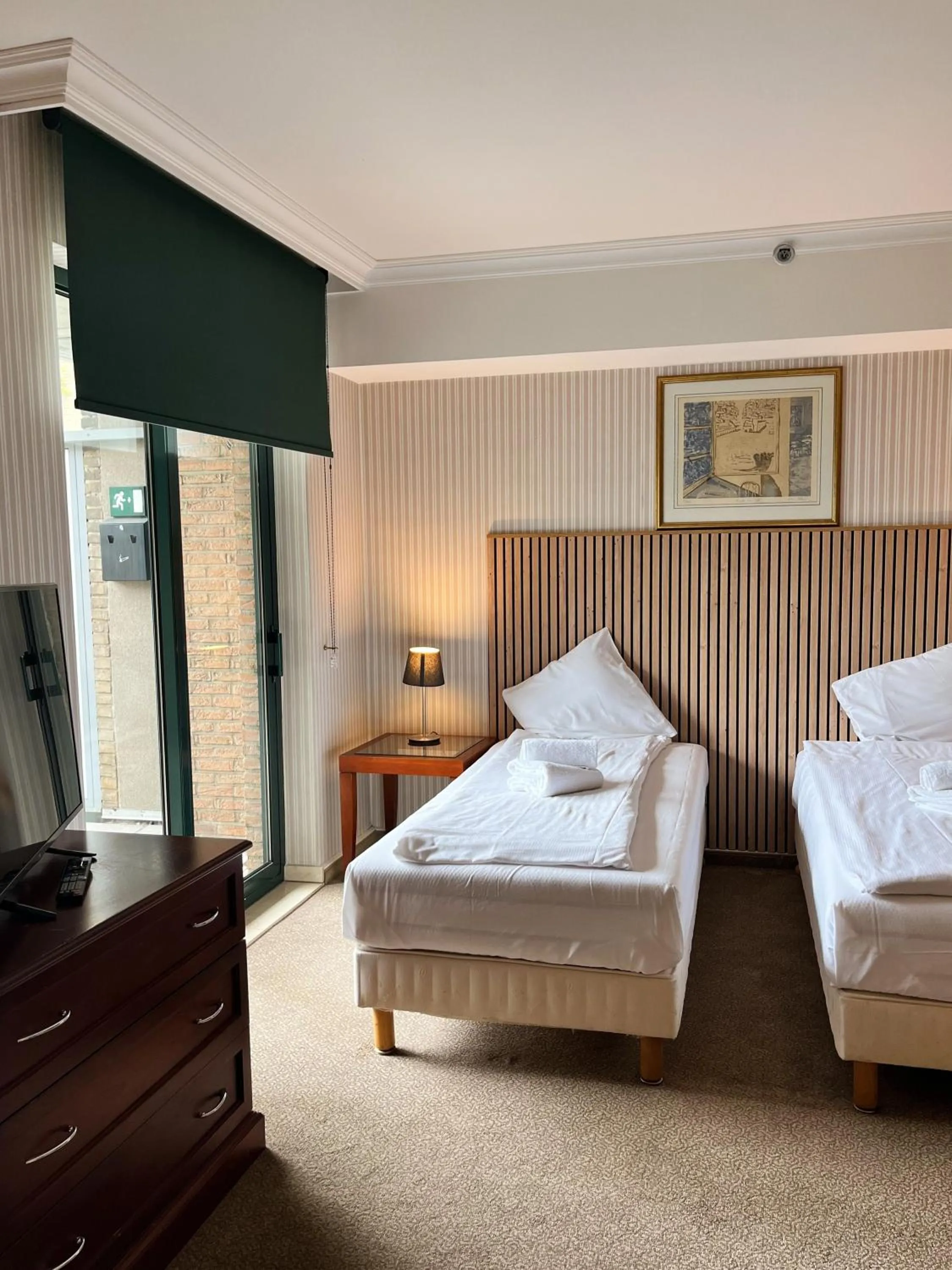 Bed in B-aparthotel Ambiorix