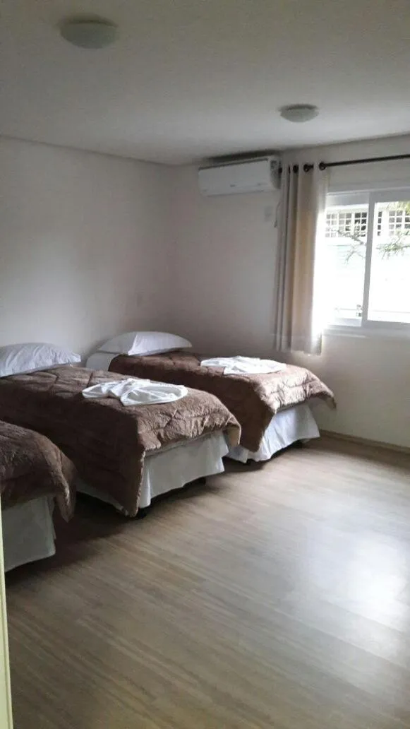 Bed in Pousada Beija Flor Centro