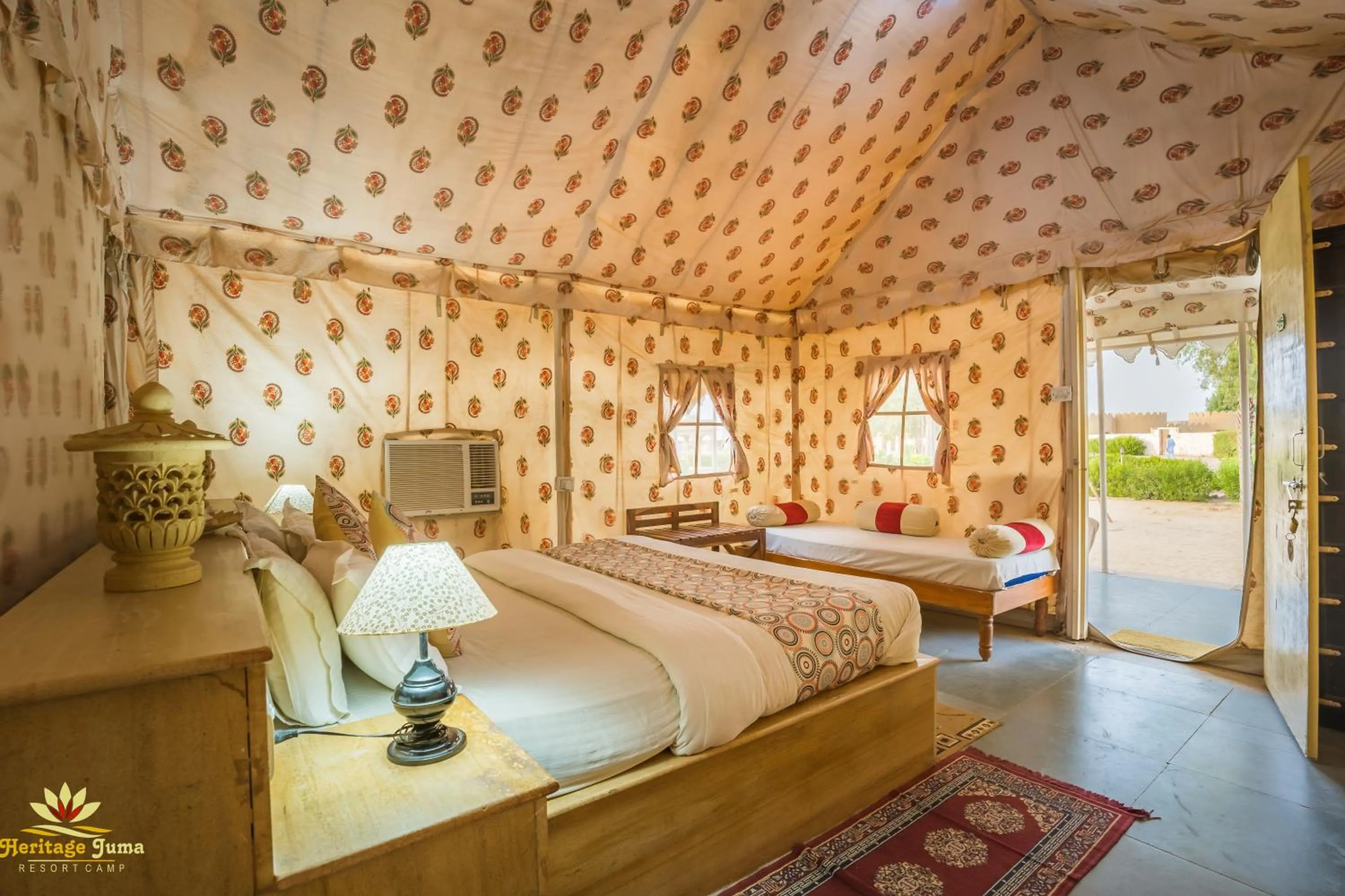 Bed in Heritage Juma Resort with swimming pool