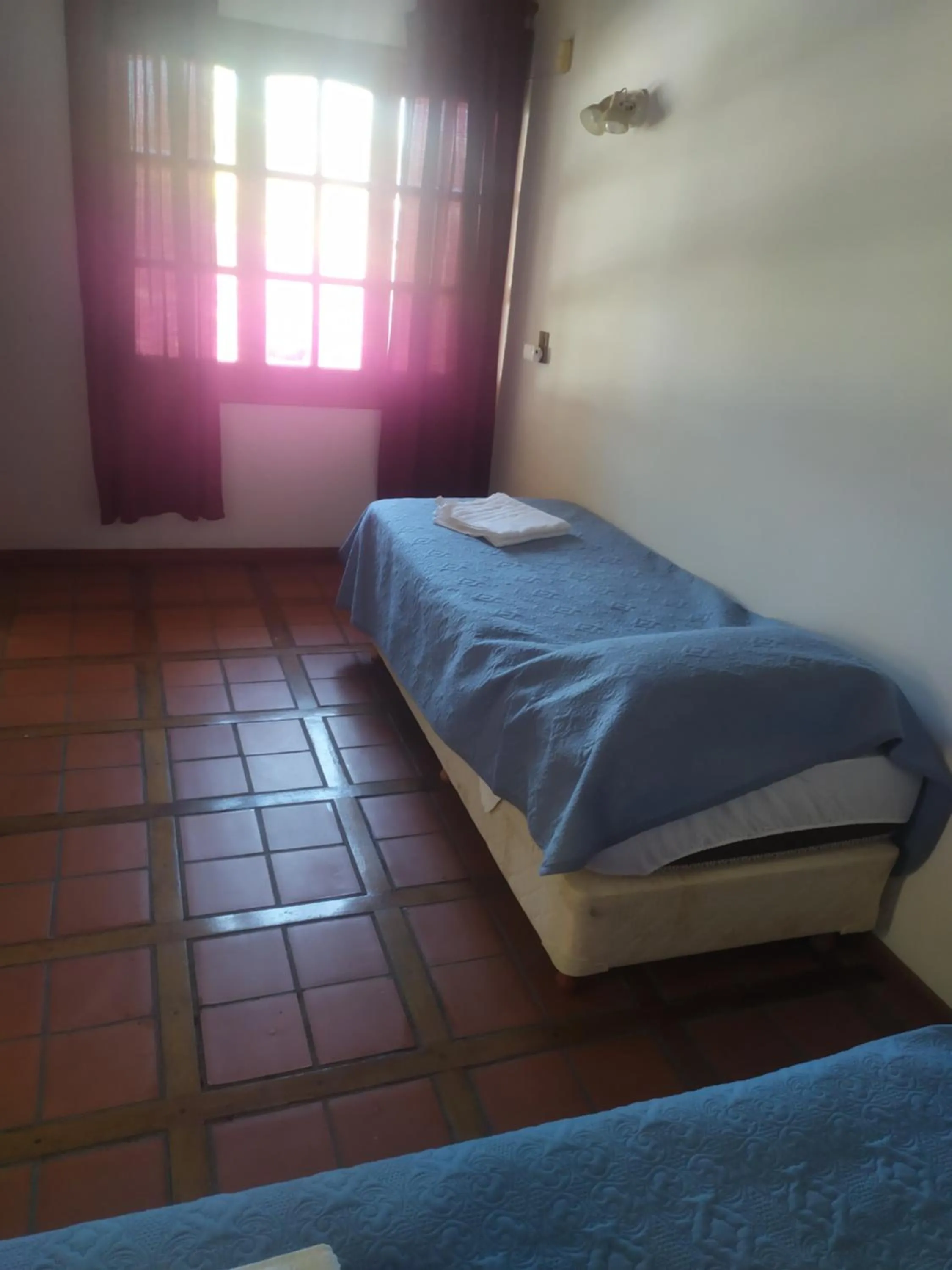 Bed in Tanino Guest House