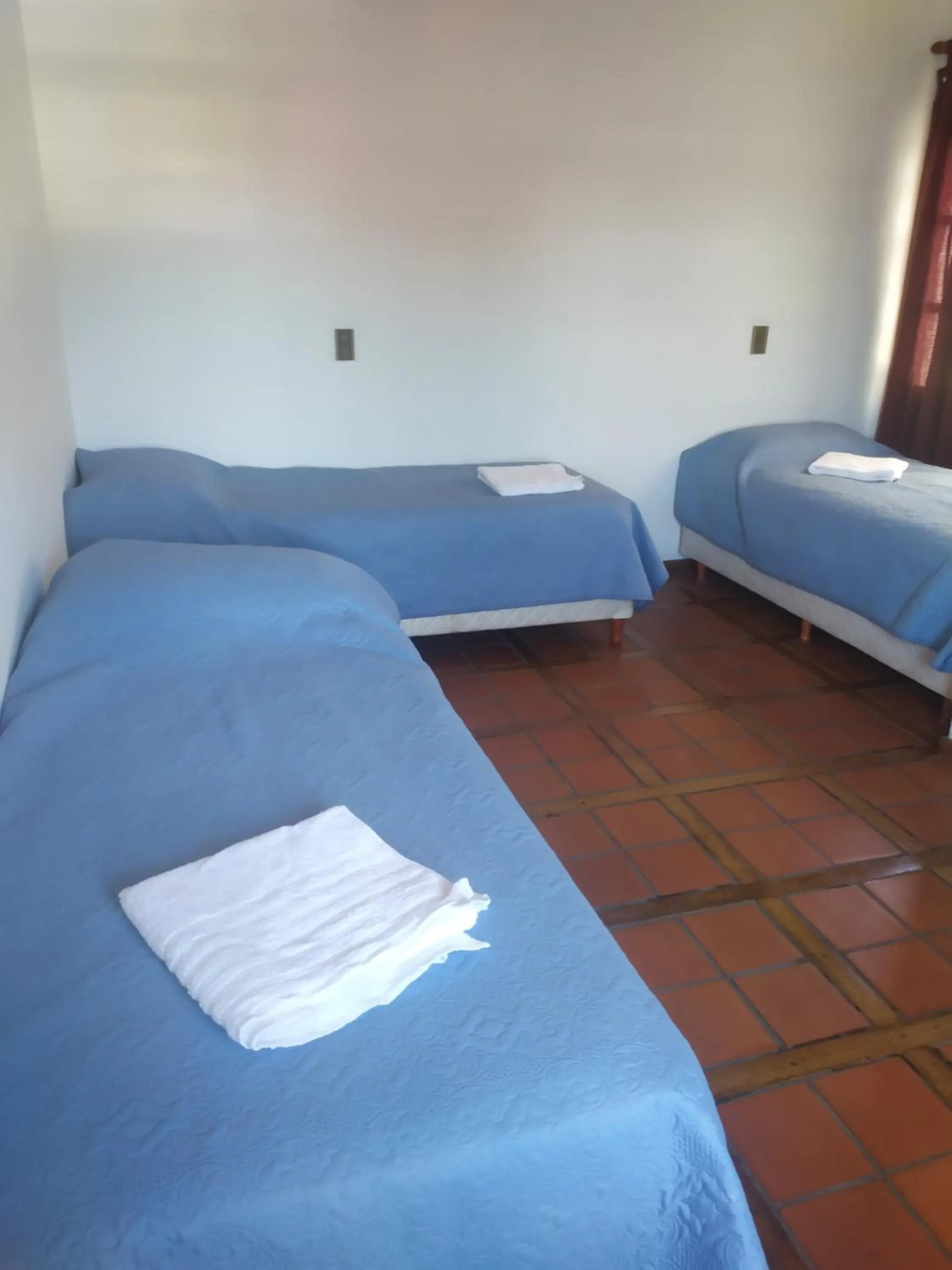 Bed in Tanino Guest House