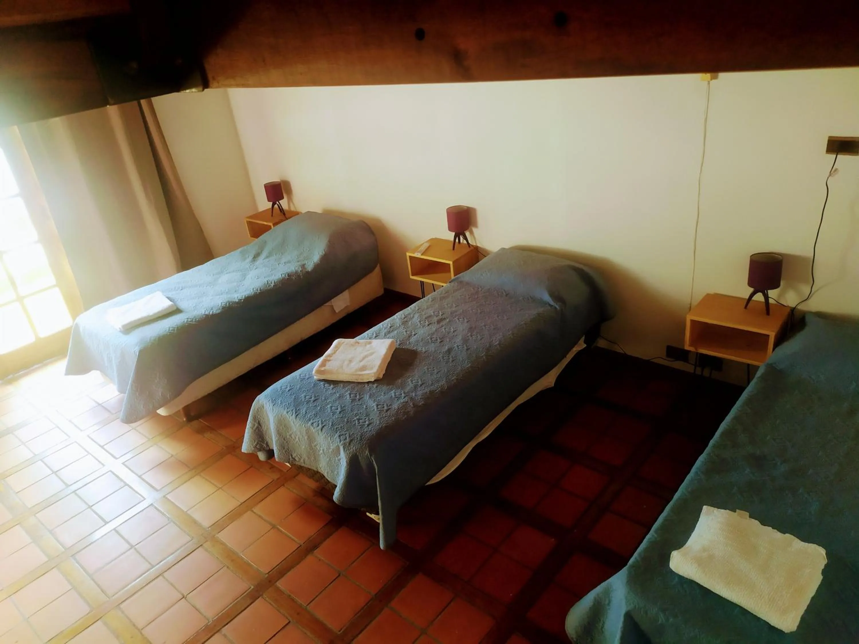 Bed in Tanino Guest House