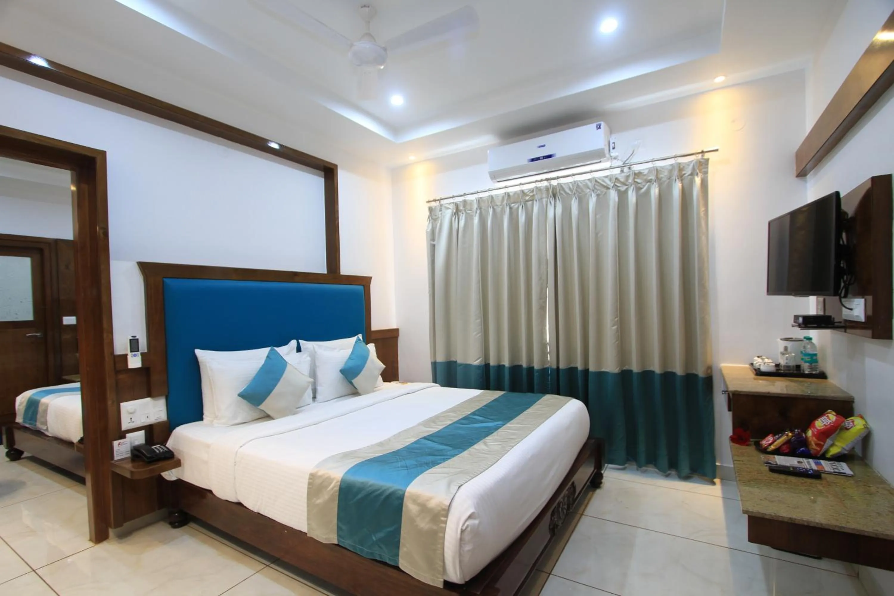 Bed in Hotel Lok Sagar Mysore