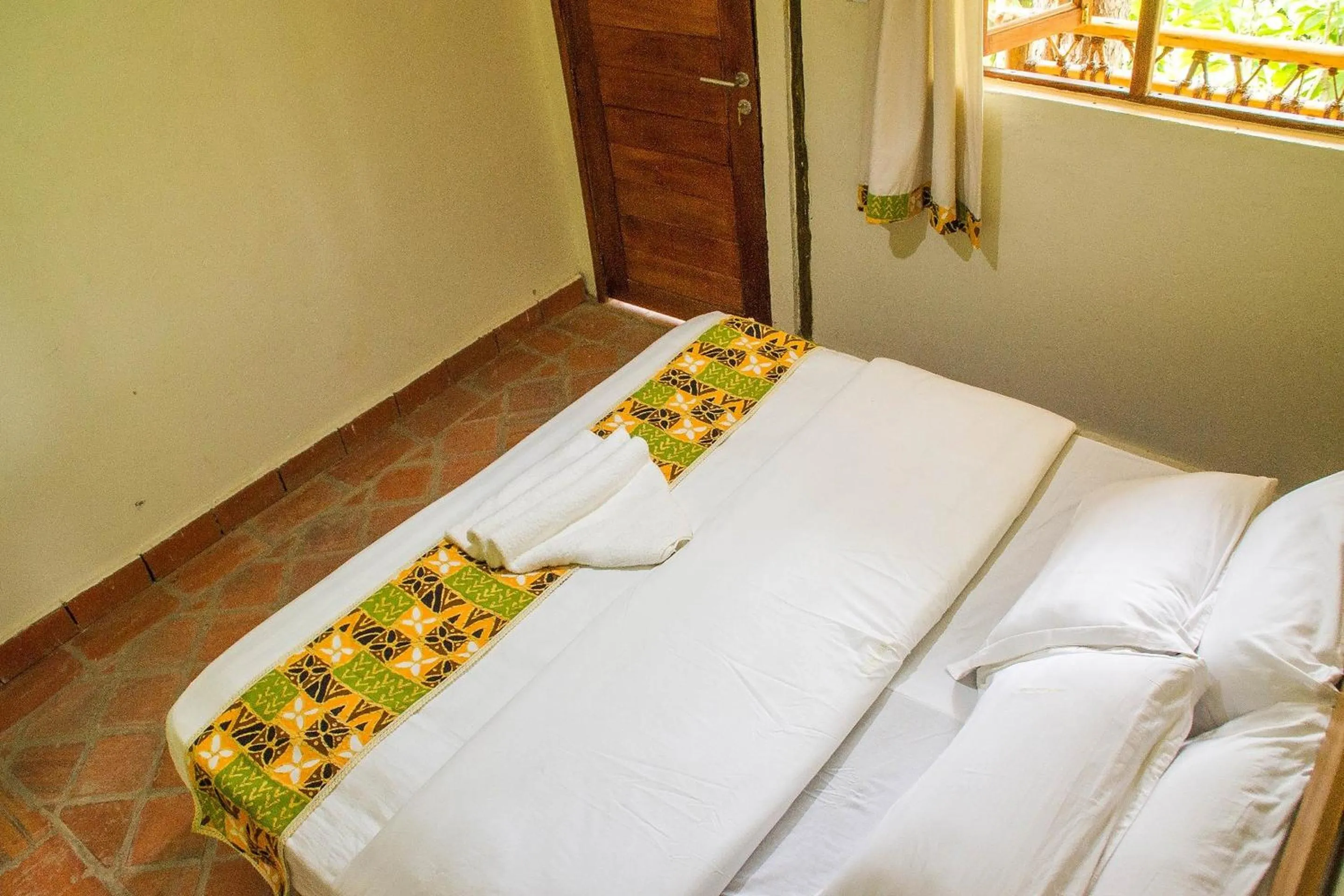 Bed in Ichumbi Gorilla Lodge