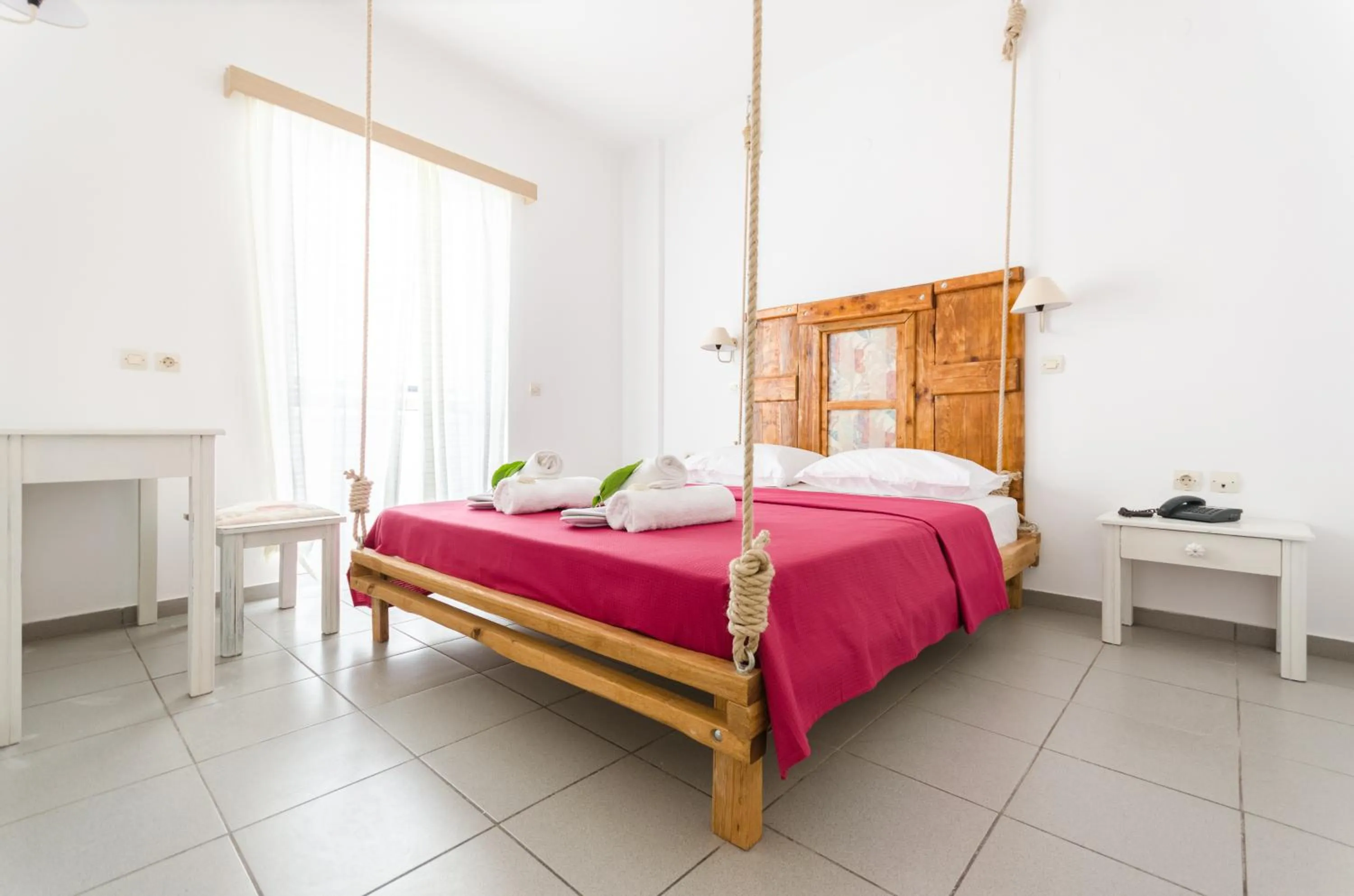 Bed in Happiness Apartments