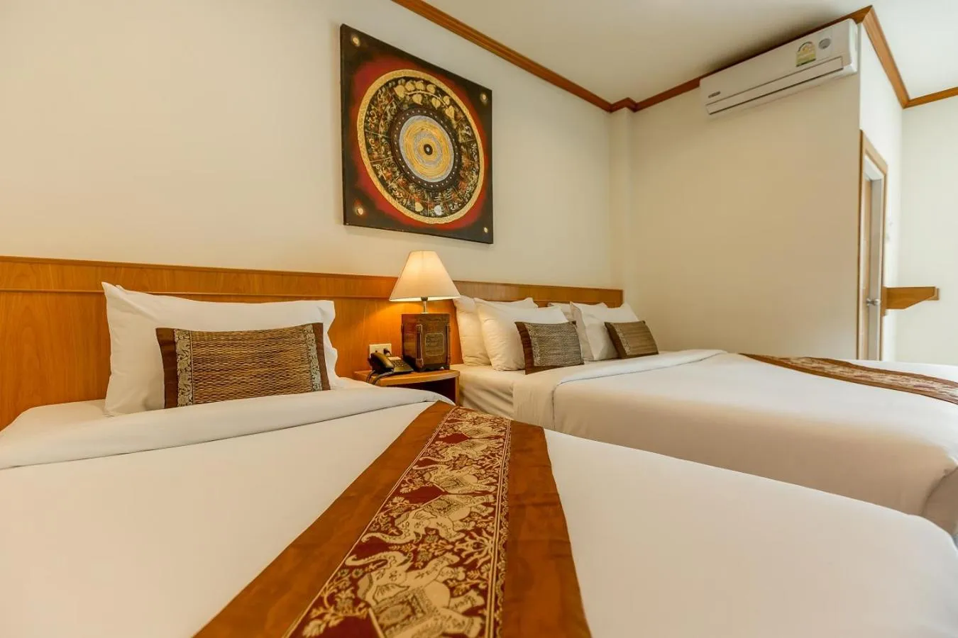 Bed in Loei Village Hotel