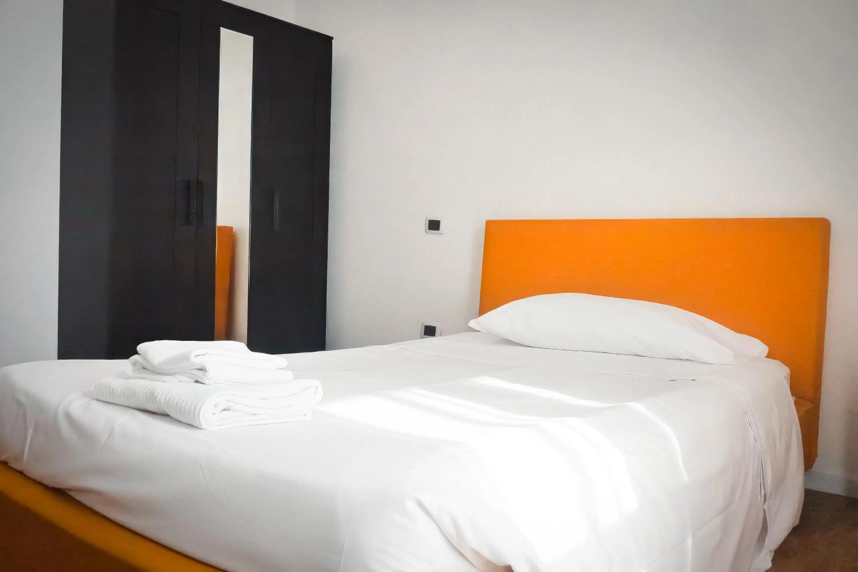 Bed in La Boheme SMART Hotel