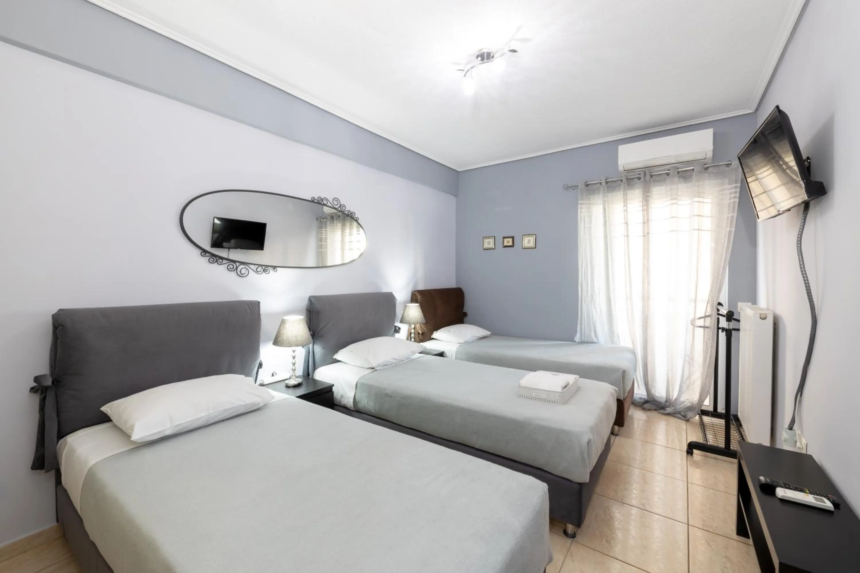 TV and multimedia, Bed in A&J Apartments or Rooms athens airport
