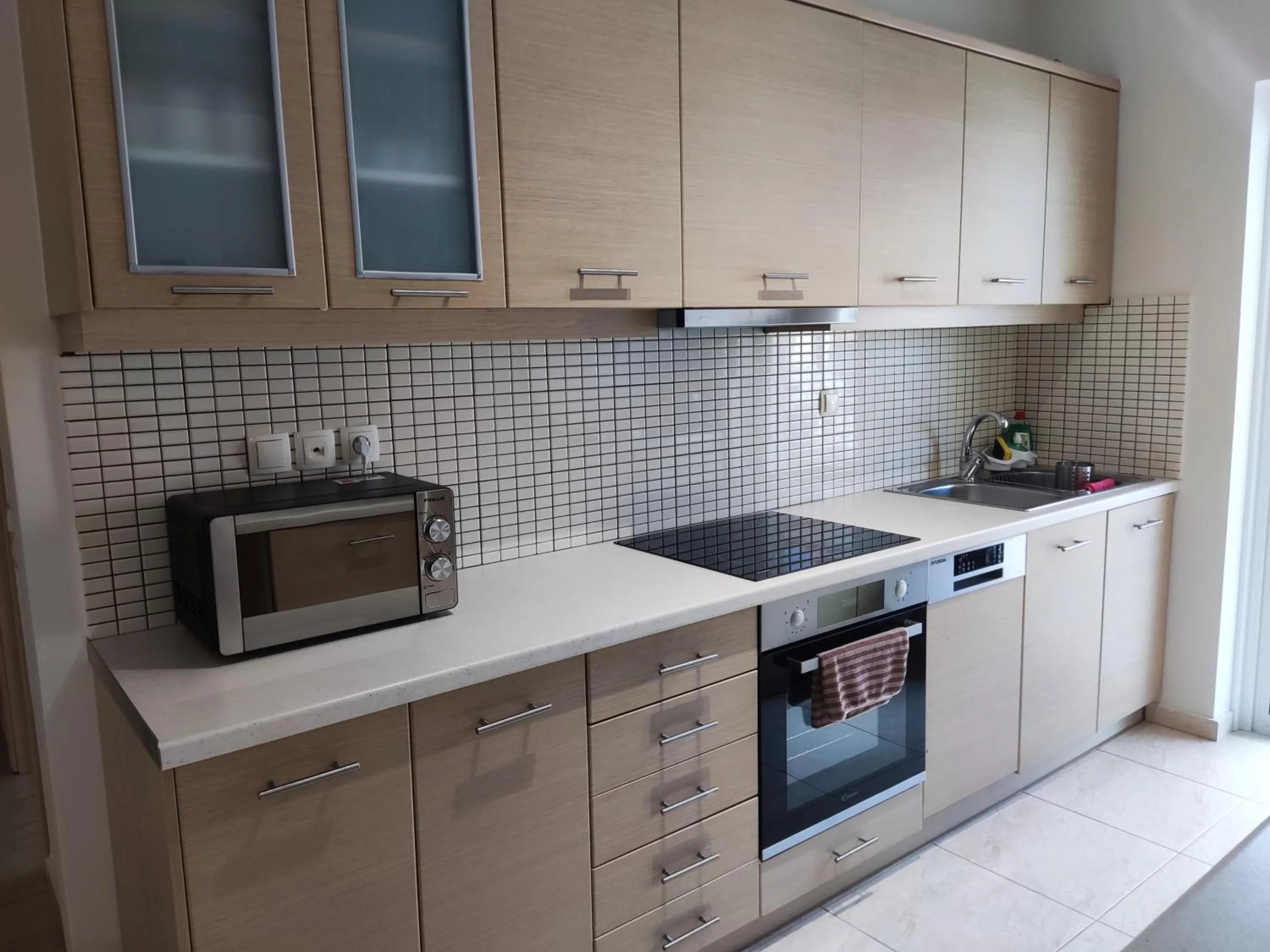Kitchen or kitchenette in A&J Apartments or Rooms athens airport
