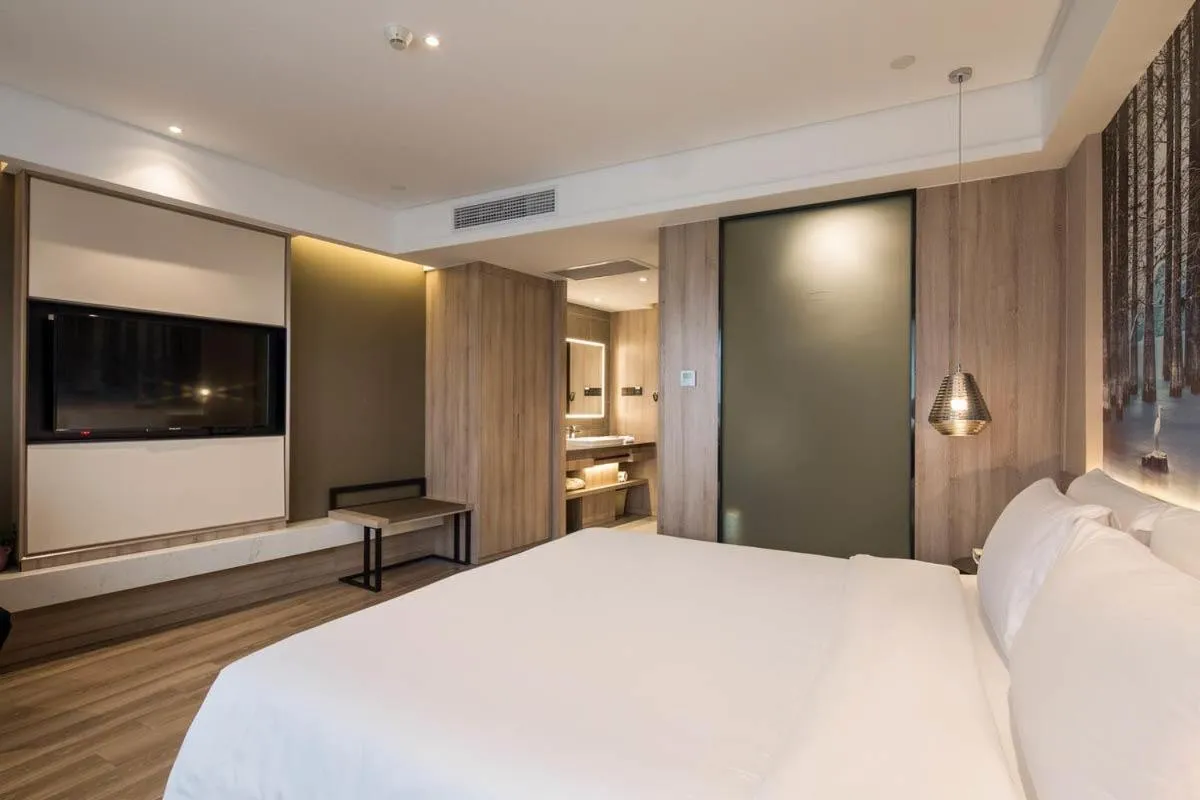 Bed in Ningbo Tianyi Square Atour Hotel