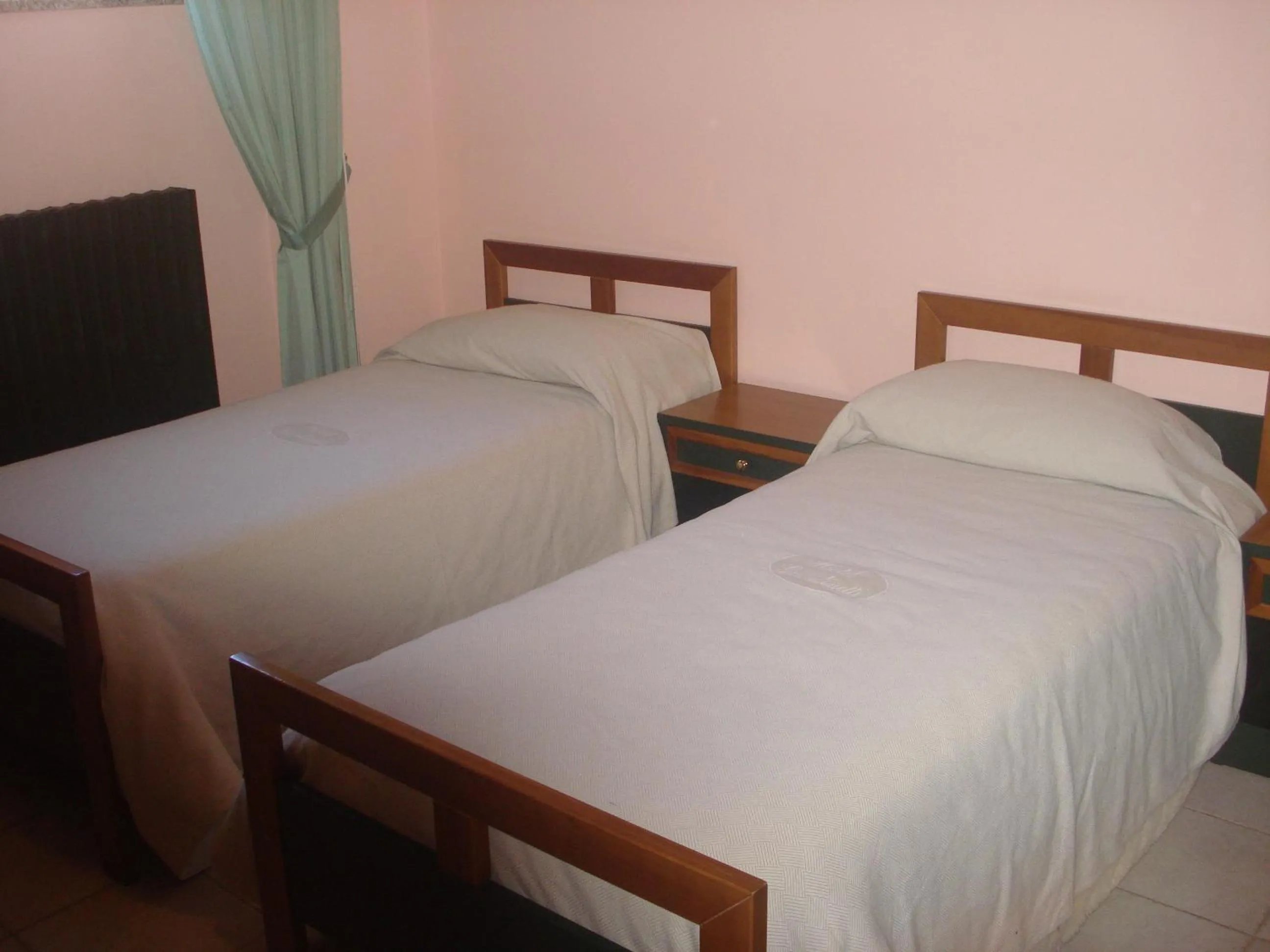 Property building, Bed in Hotel Grandinetti