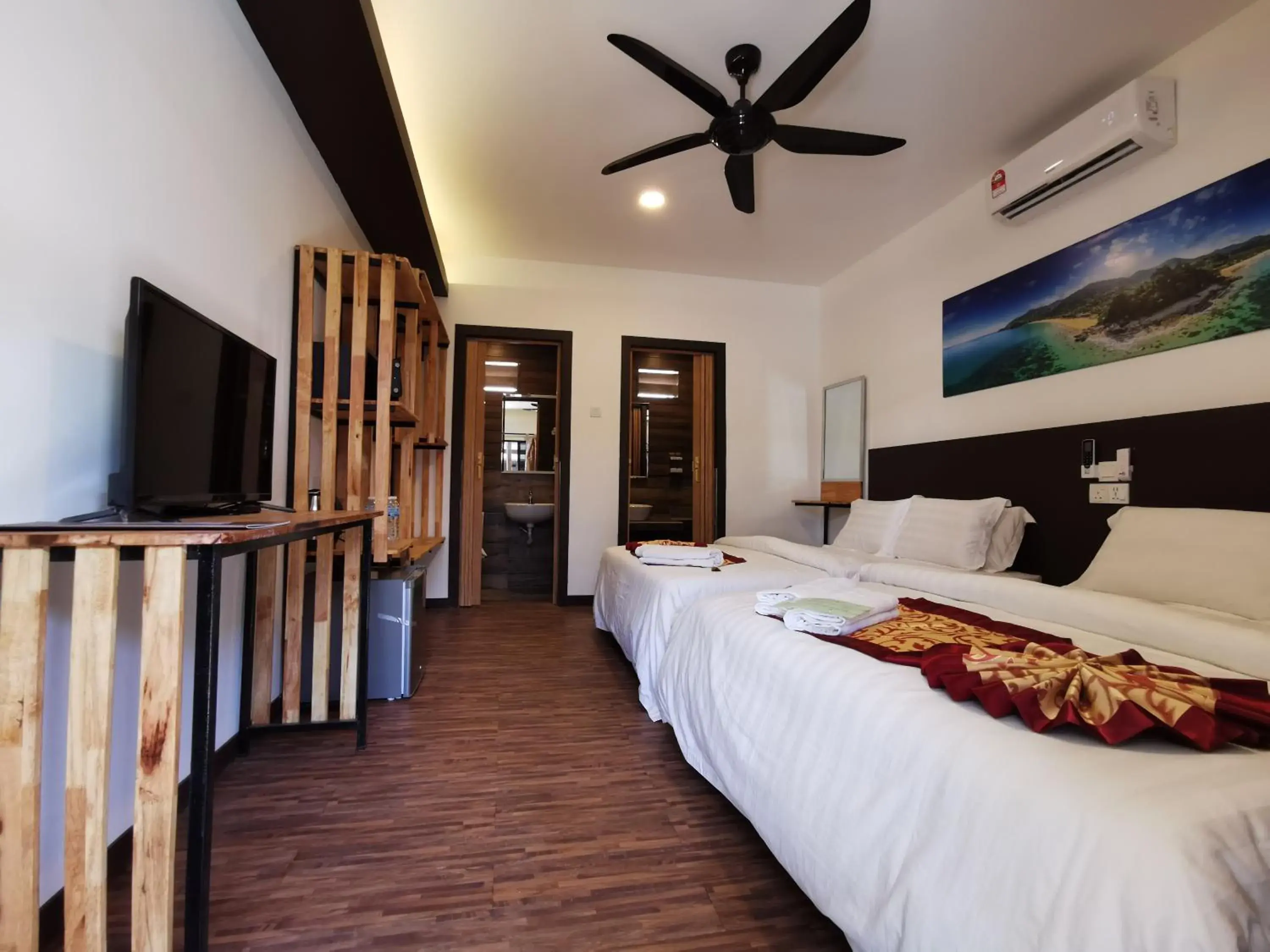 Bed in The Barat Tioman Beach Resort Bed in The Barat Tioman Beach Resort