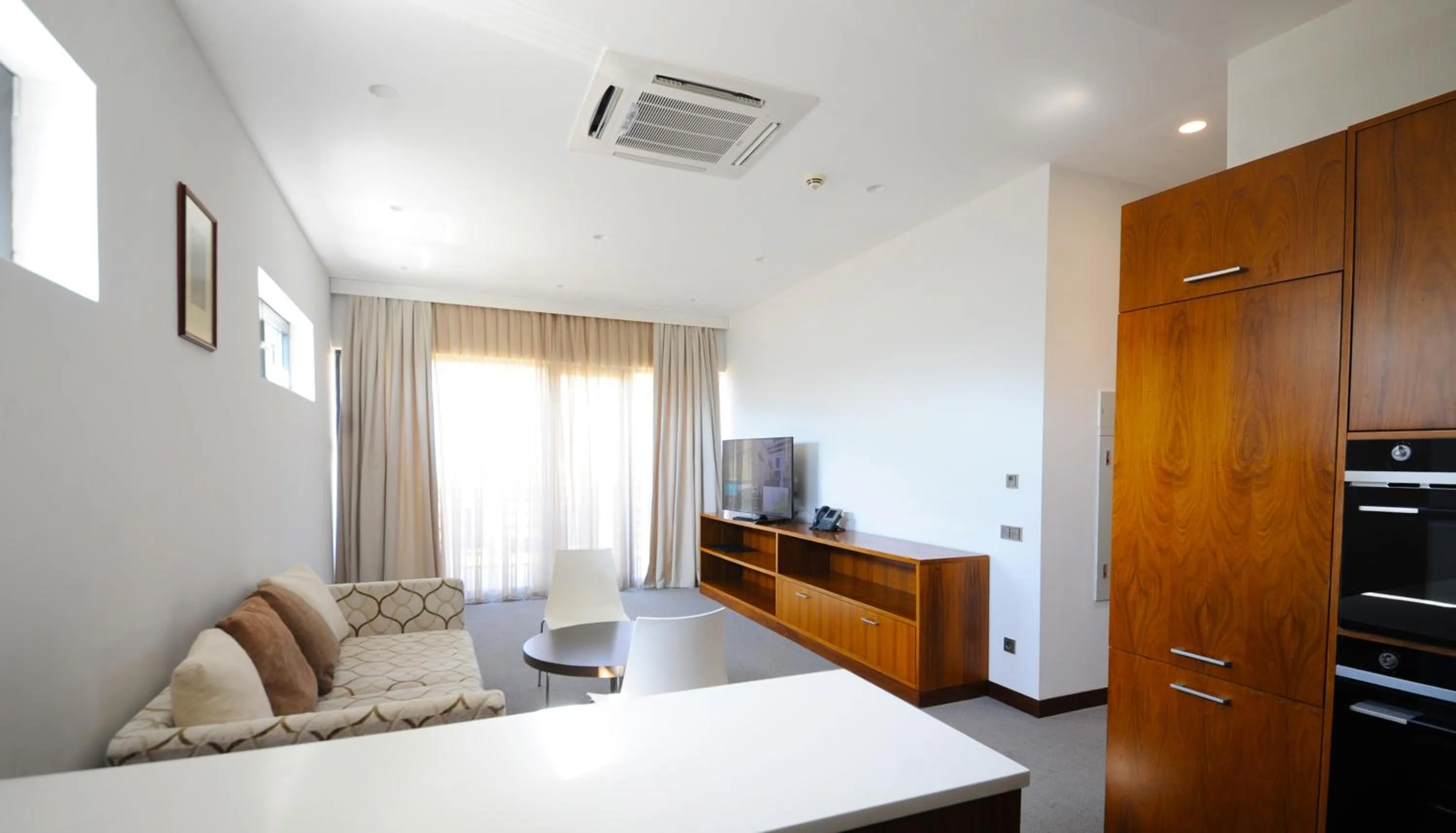 Living room, Bed in Gaya Residences